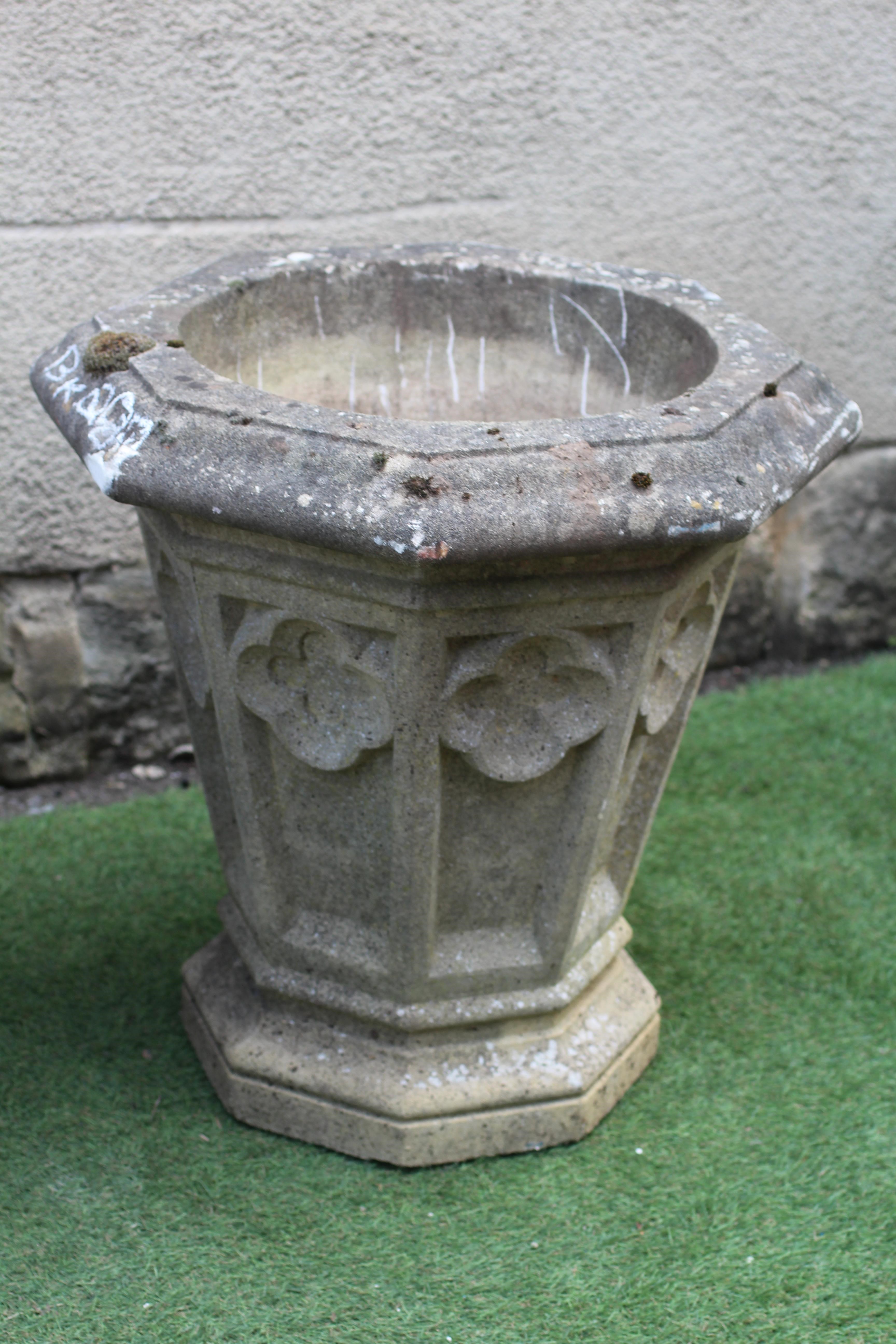 A SET OF THREE GOTHIC PLANTERS to match previous lots Image