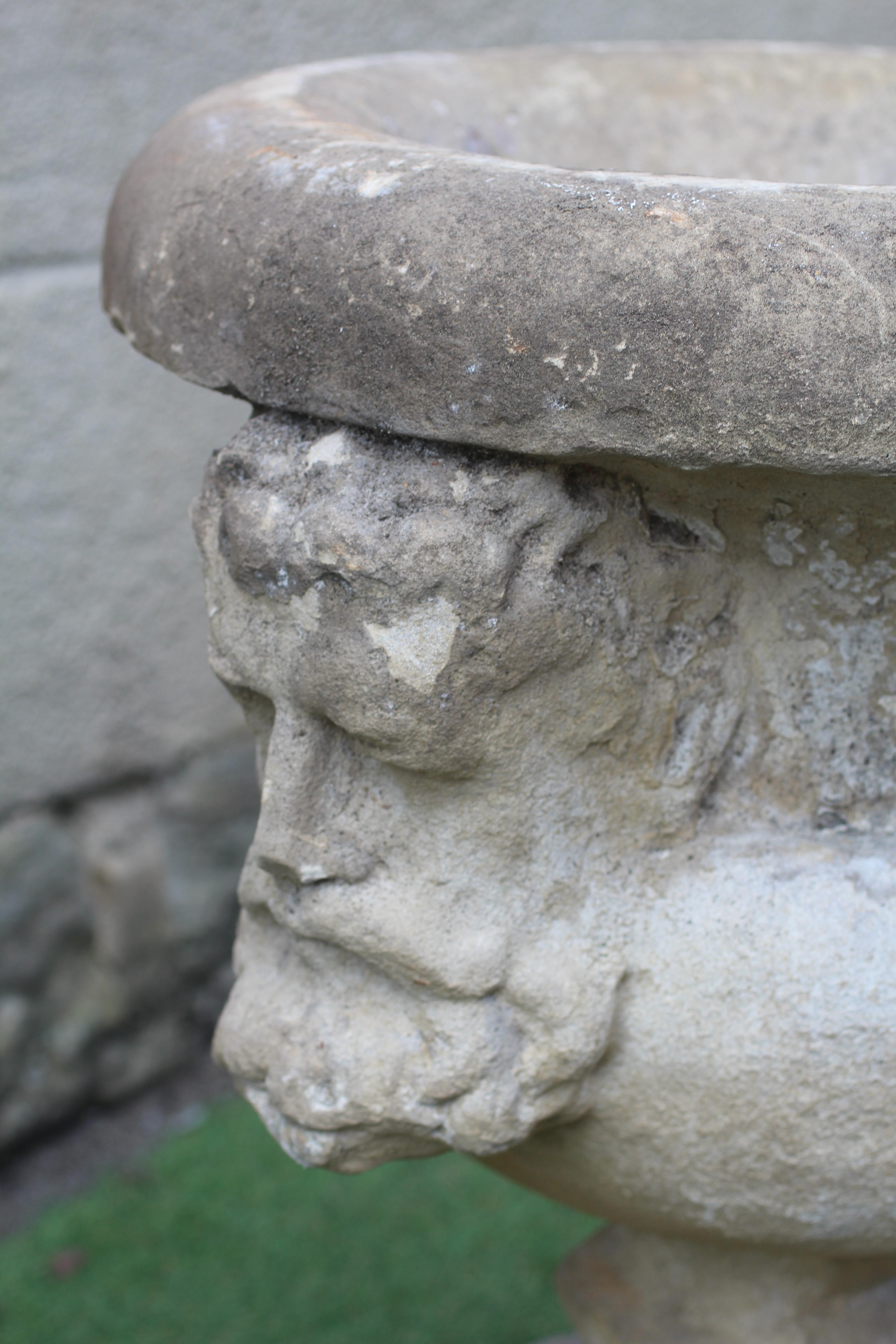 A SANDSTONE CAMPANA URN, 19th century/earlier(?), with fold over rim, the bowl with bearded male Image