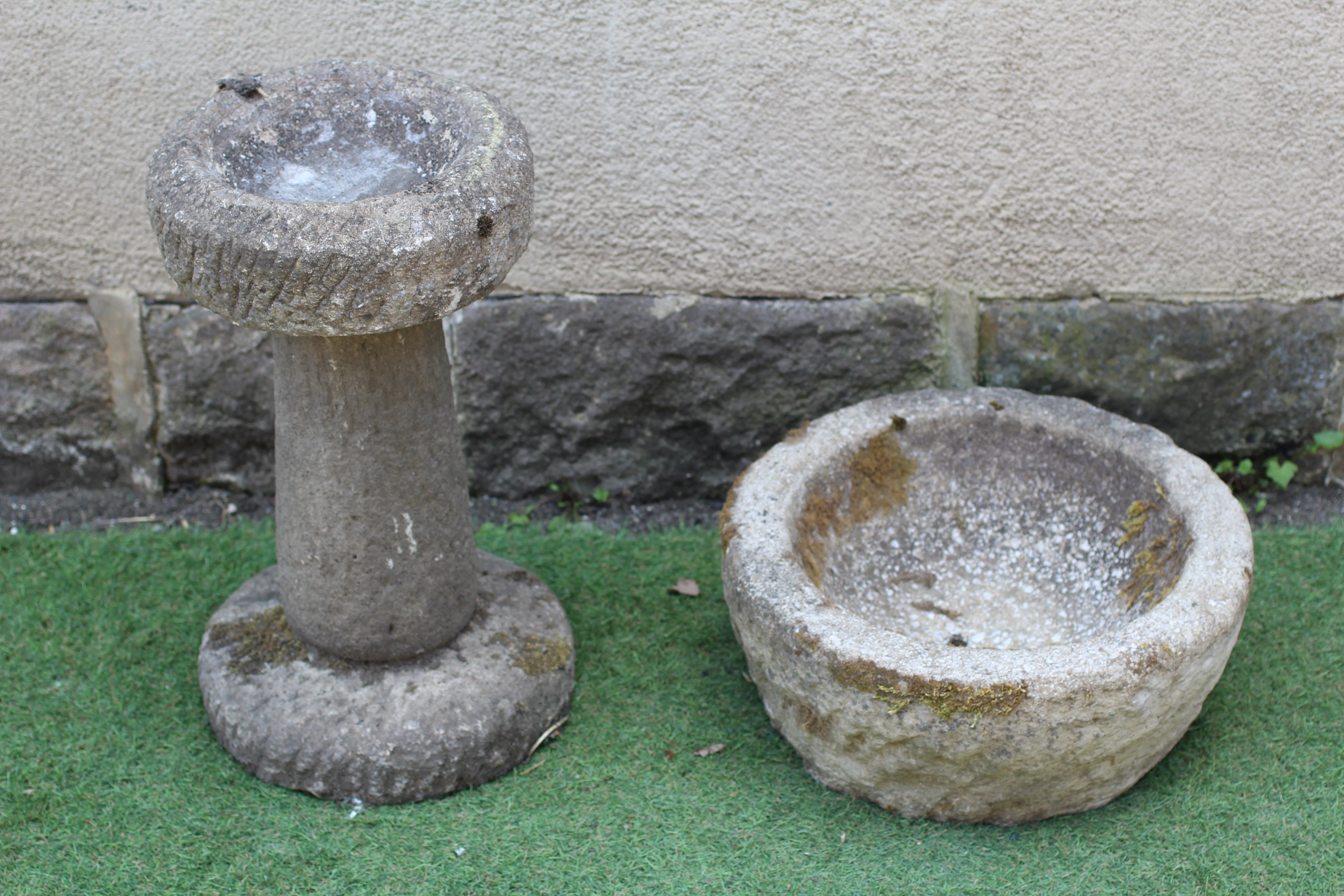 A SANDSTONE CIRCULAR PLANTER with textured tapering bowl, 17" w x 7 1/2" h, together with a similar Image
