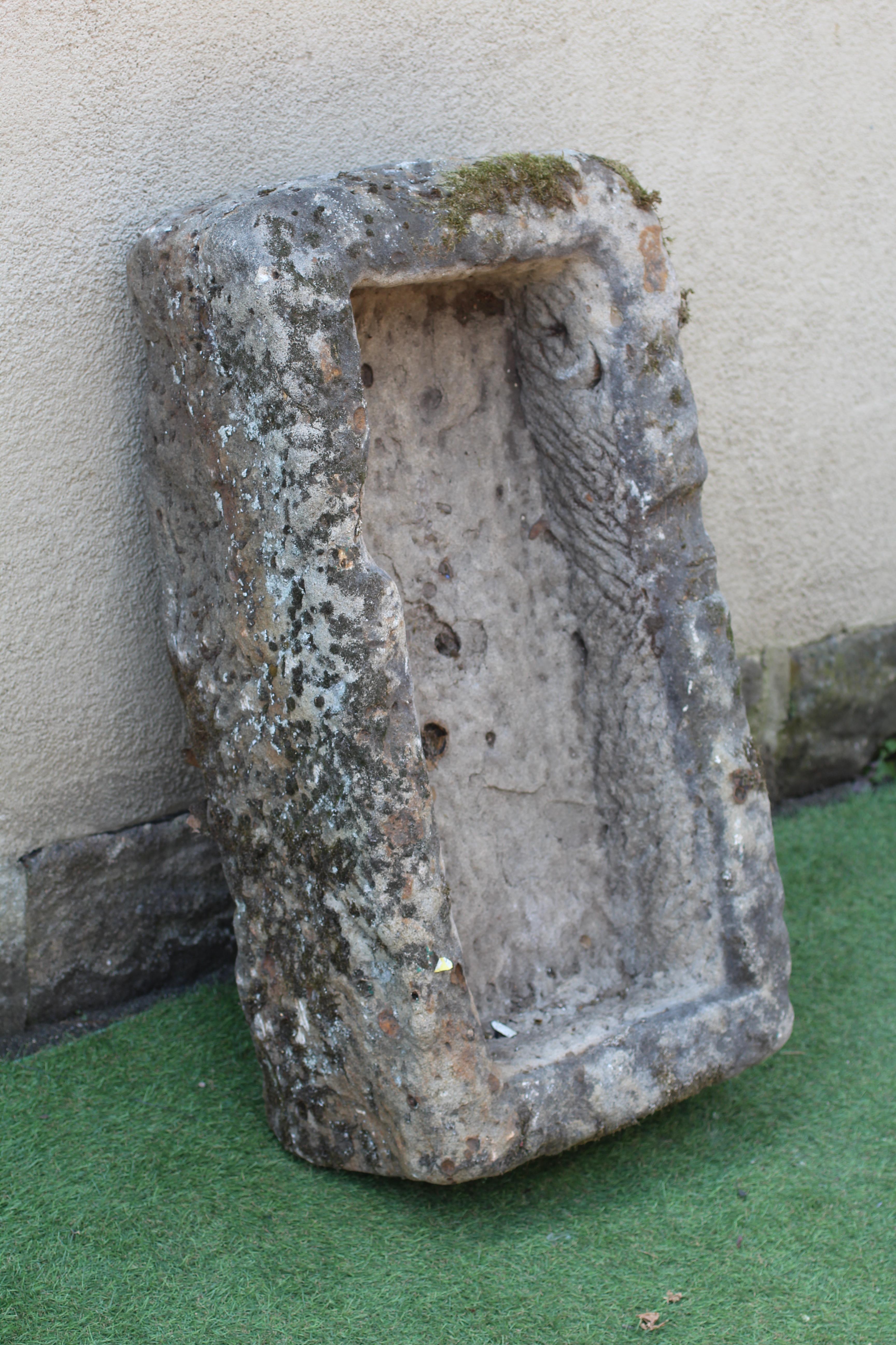 A SANDSTONE TROUGH of rough hewn oblong form, 36 1/2" w x 18" d x 12 1/2" h Image