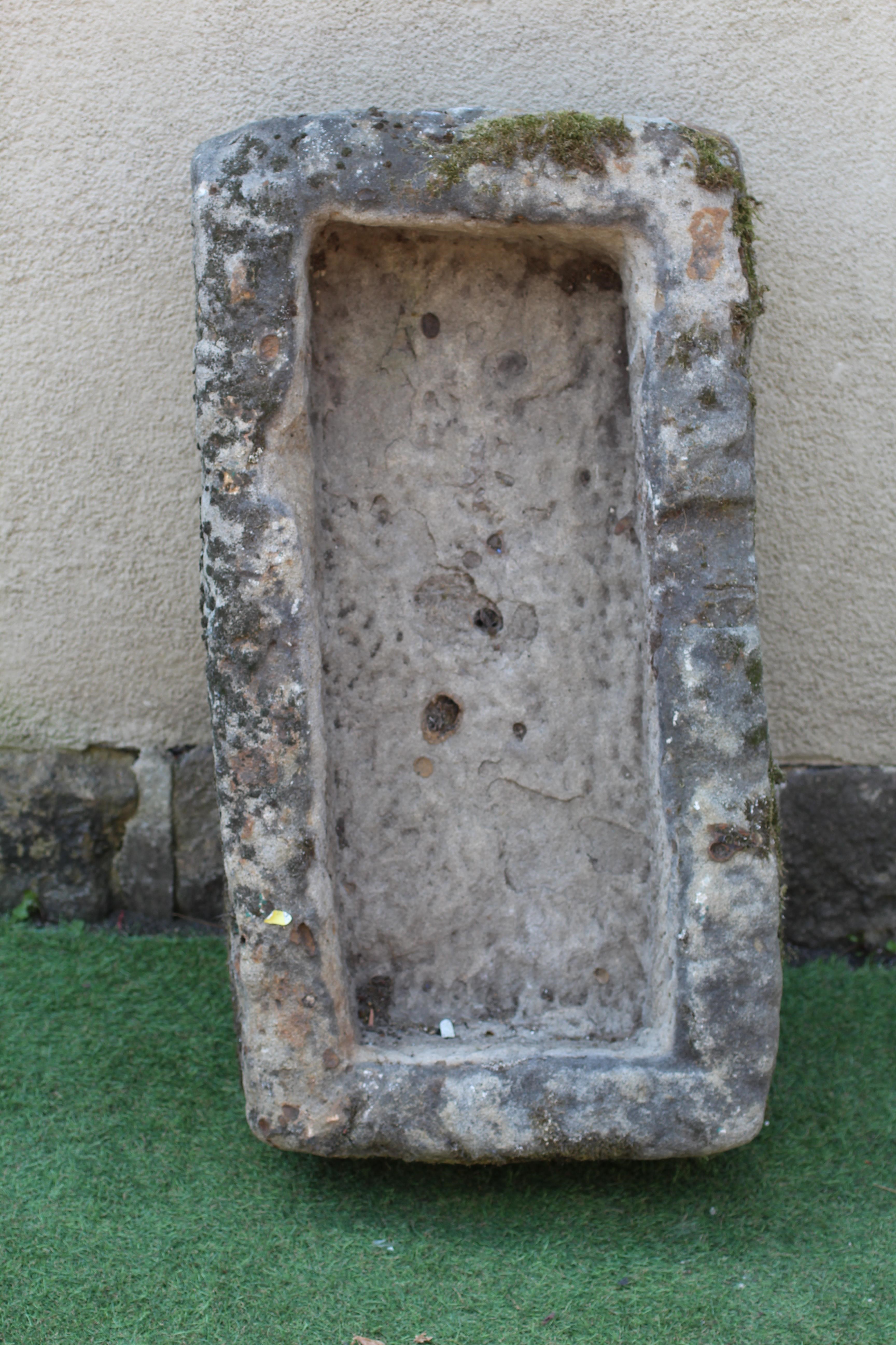 A SANDSTONE TROUGH of rough hewn oblong form, 36 1/2" w x 18" d x 12 1/2" h Image