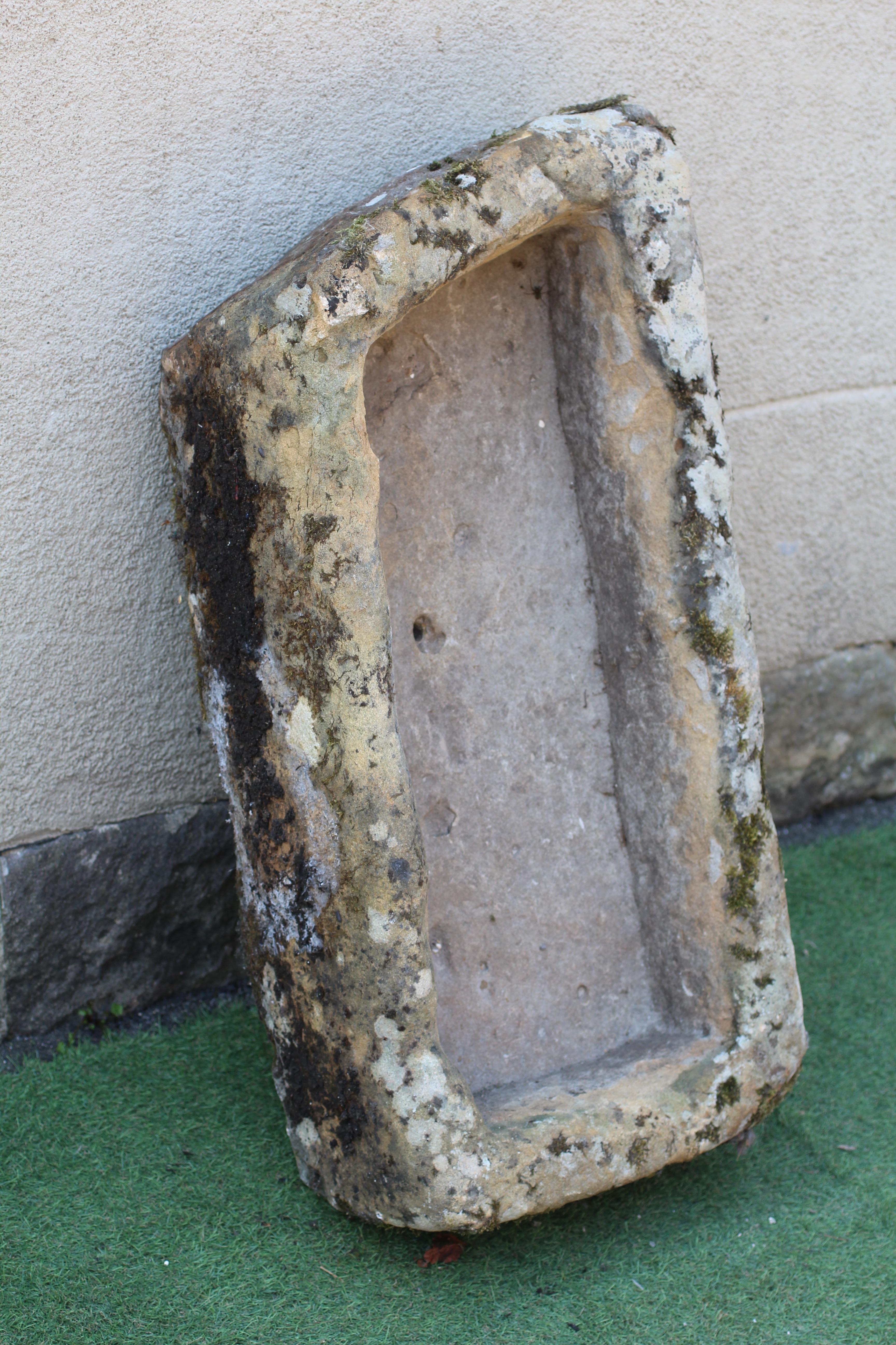 A SANDSTONE TROUGH of rough hewn oblong form, 36" w x 17 1/2" d x 10" h Image