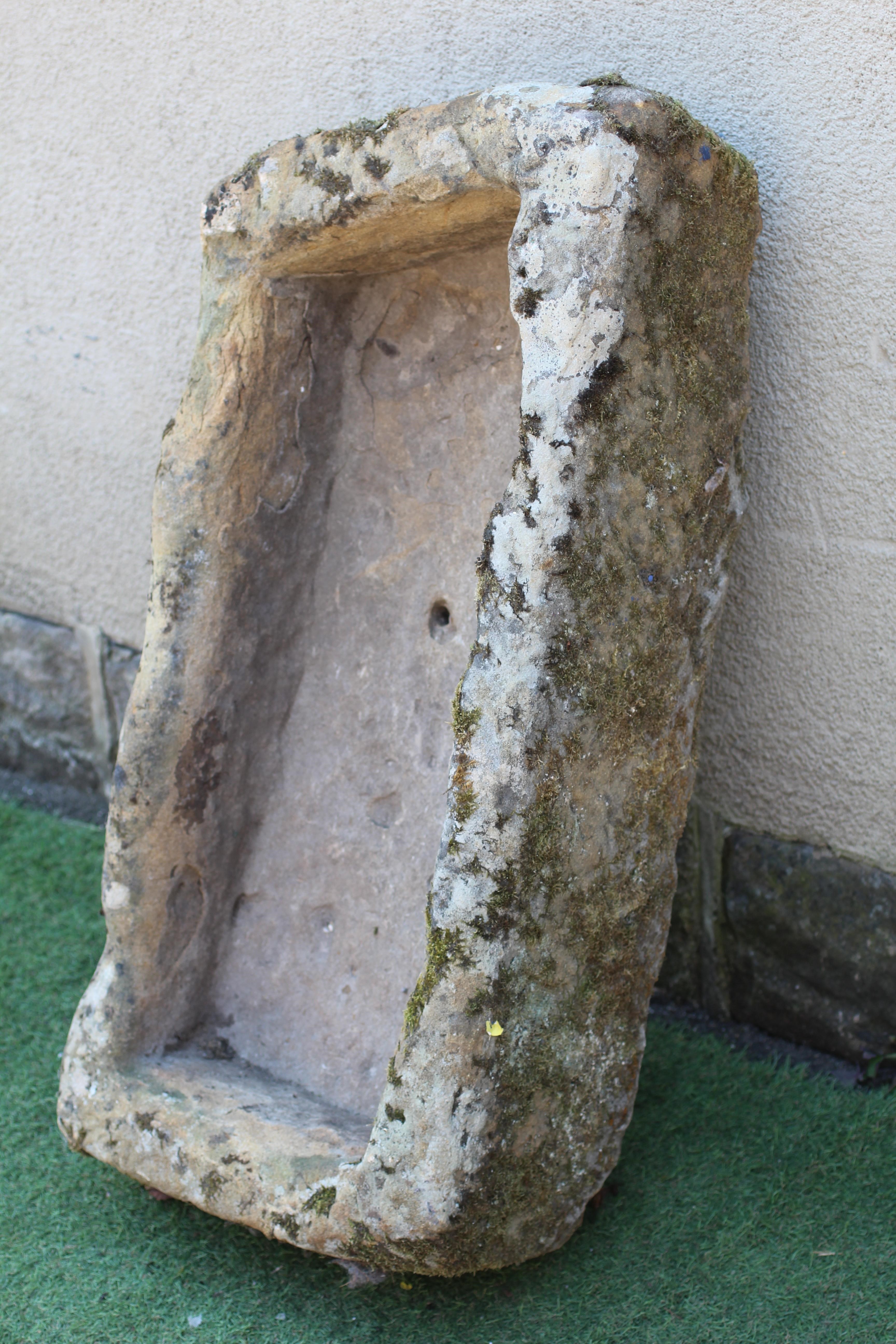 A SANDSTONE TROUGH of rough hewn oblong form, 36" w x 17 1/2" d x 10" h Image
