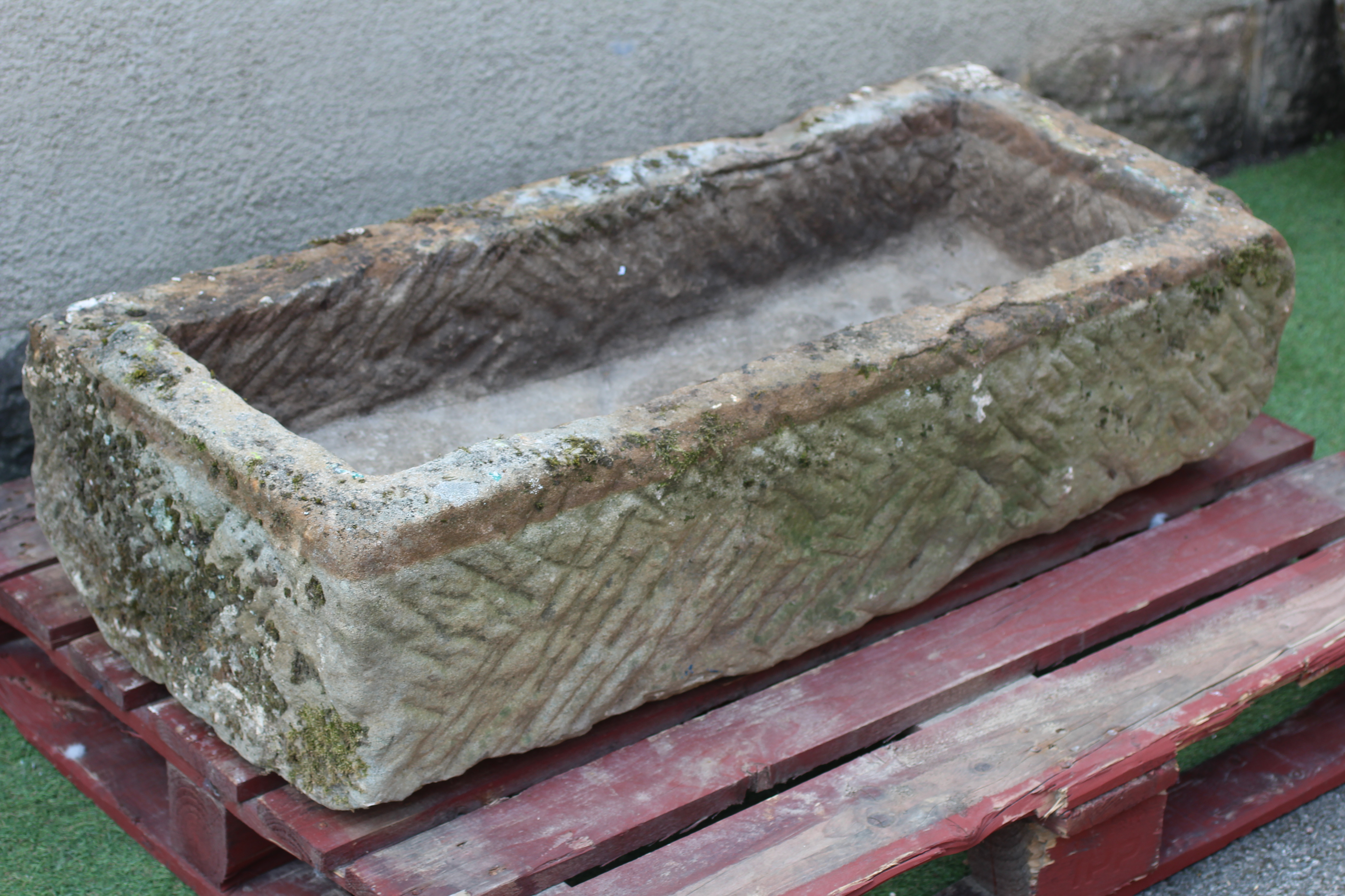 A SANDSTONE TROUGH of well cut oblong form, 45" w x 19 1/2" d x 11" h Image