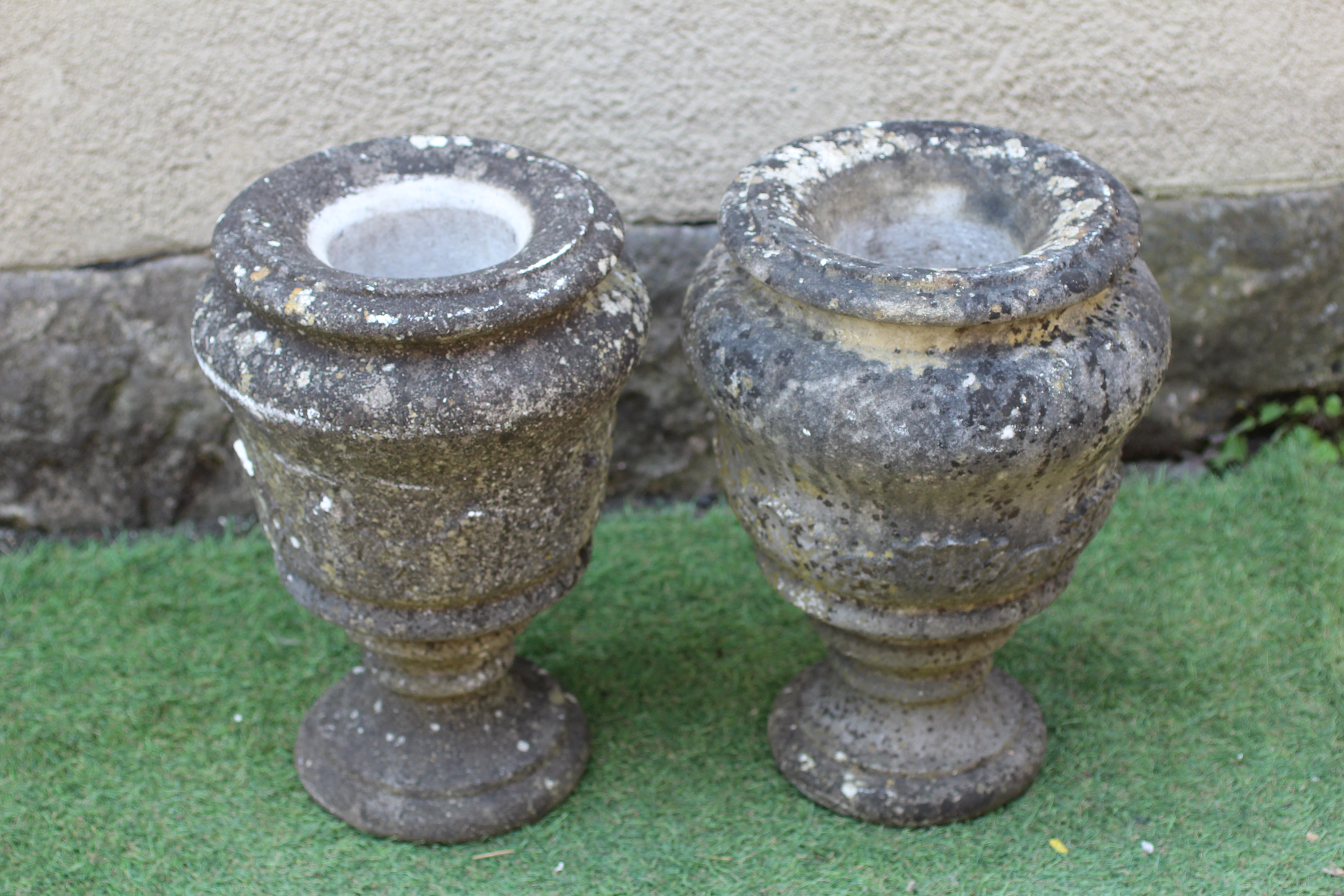 A SMALL PAIR OF WHITE MARBLE URNS of mildly ogee form with ovolu moulded rim and base, 9 1/4" w x 15 Image