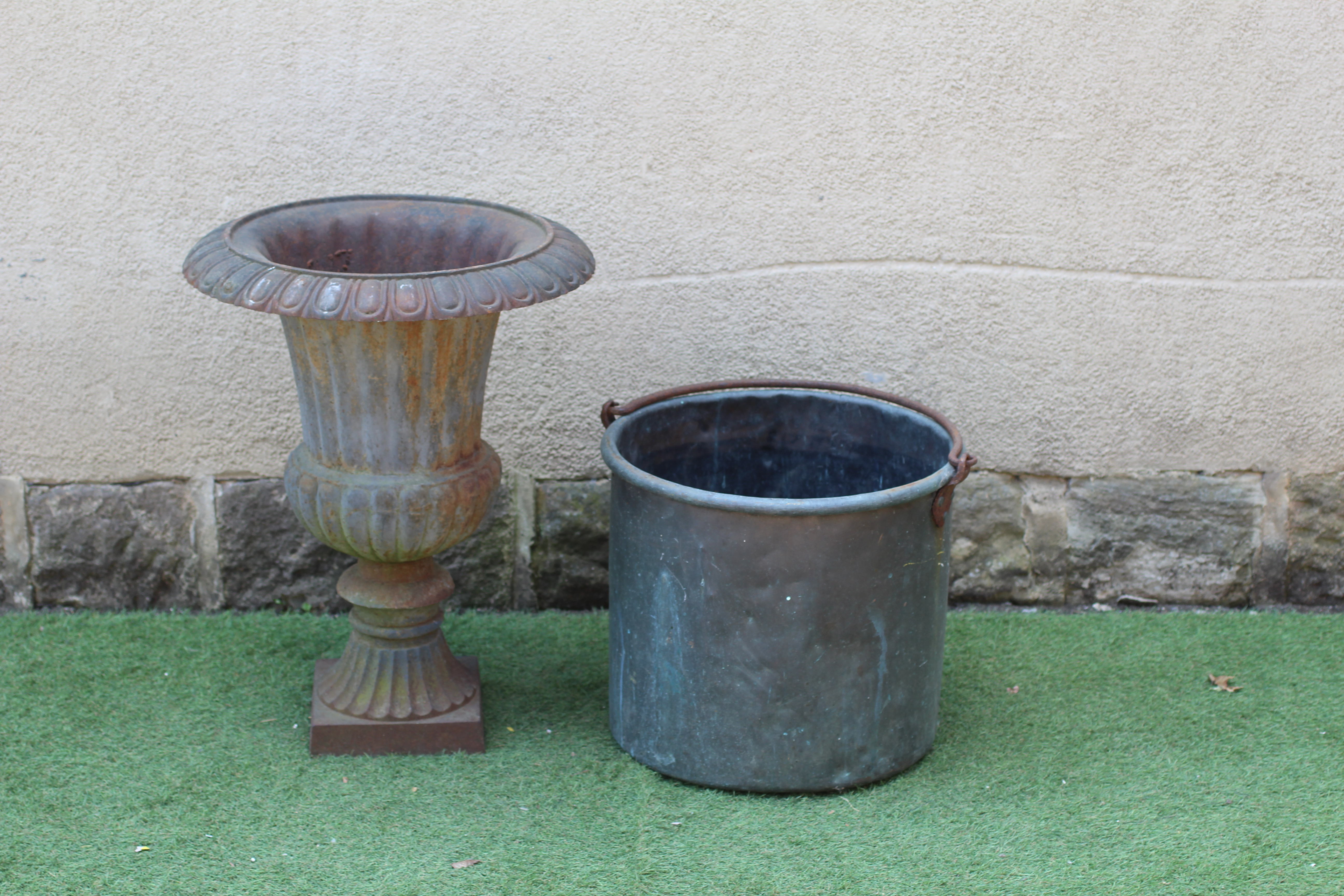 A CAST IRON URN Image
