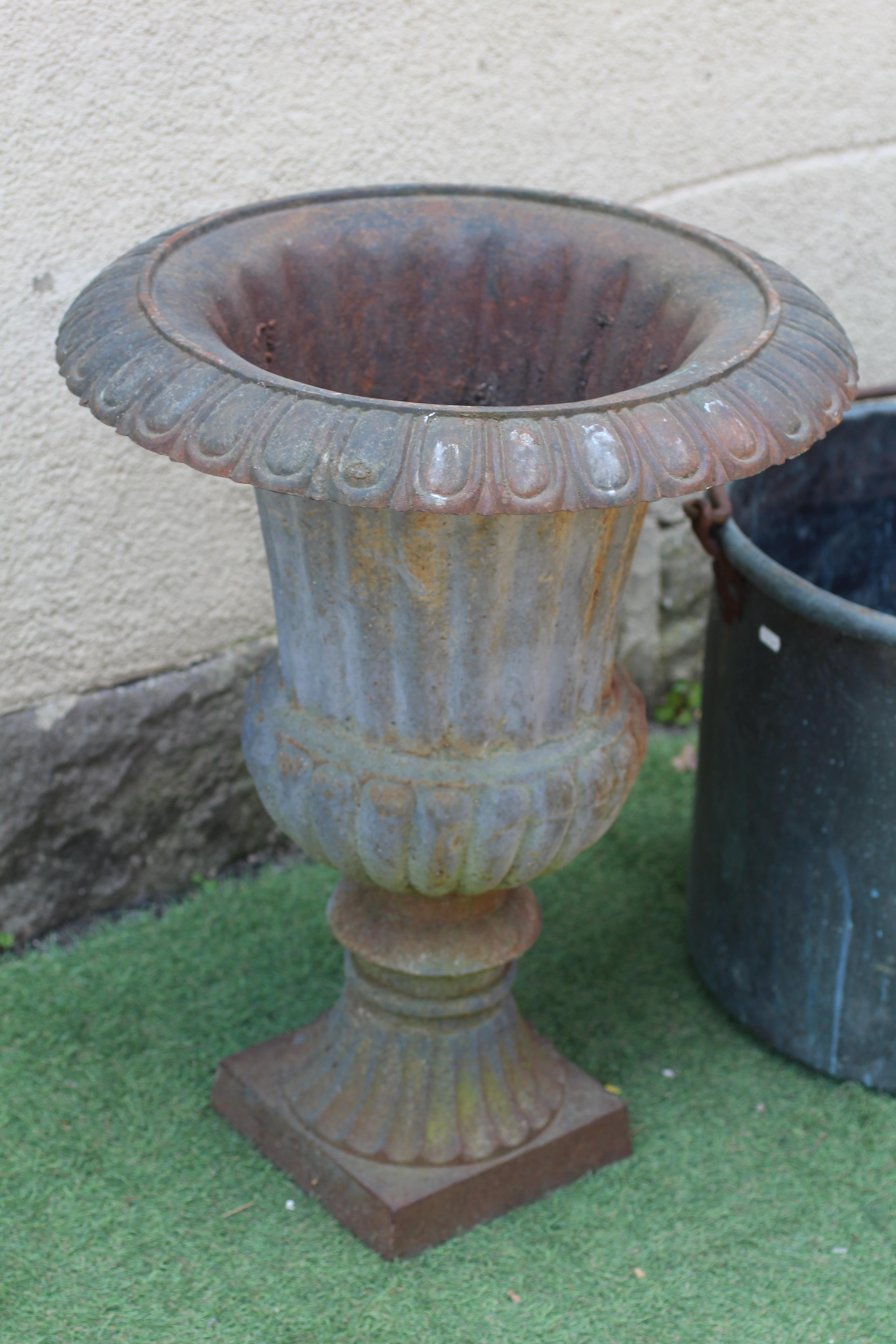 A CAST IRON URN Image