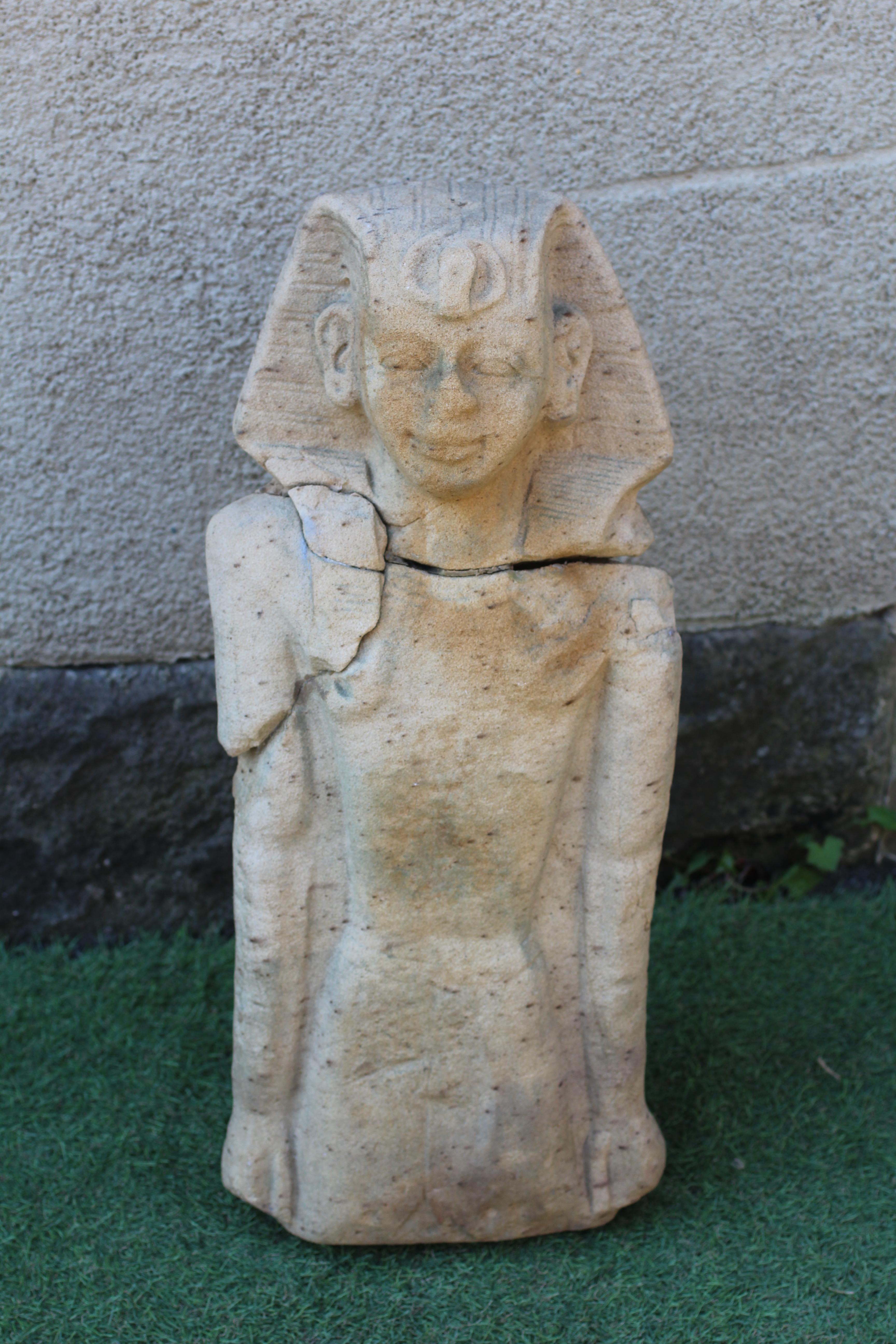 AN EGYPTIAN CARVED SANDSTONE FIGURE OF A BOY, half length and possibly antique, and with carved Image