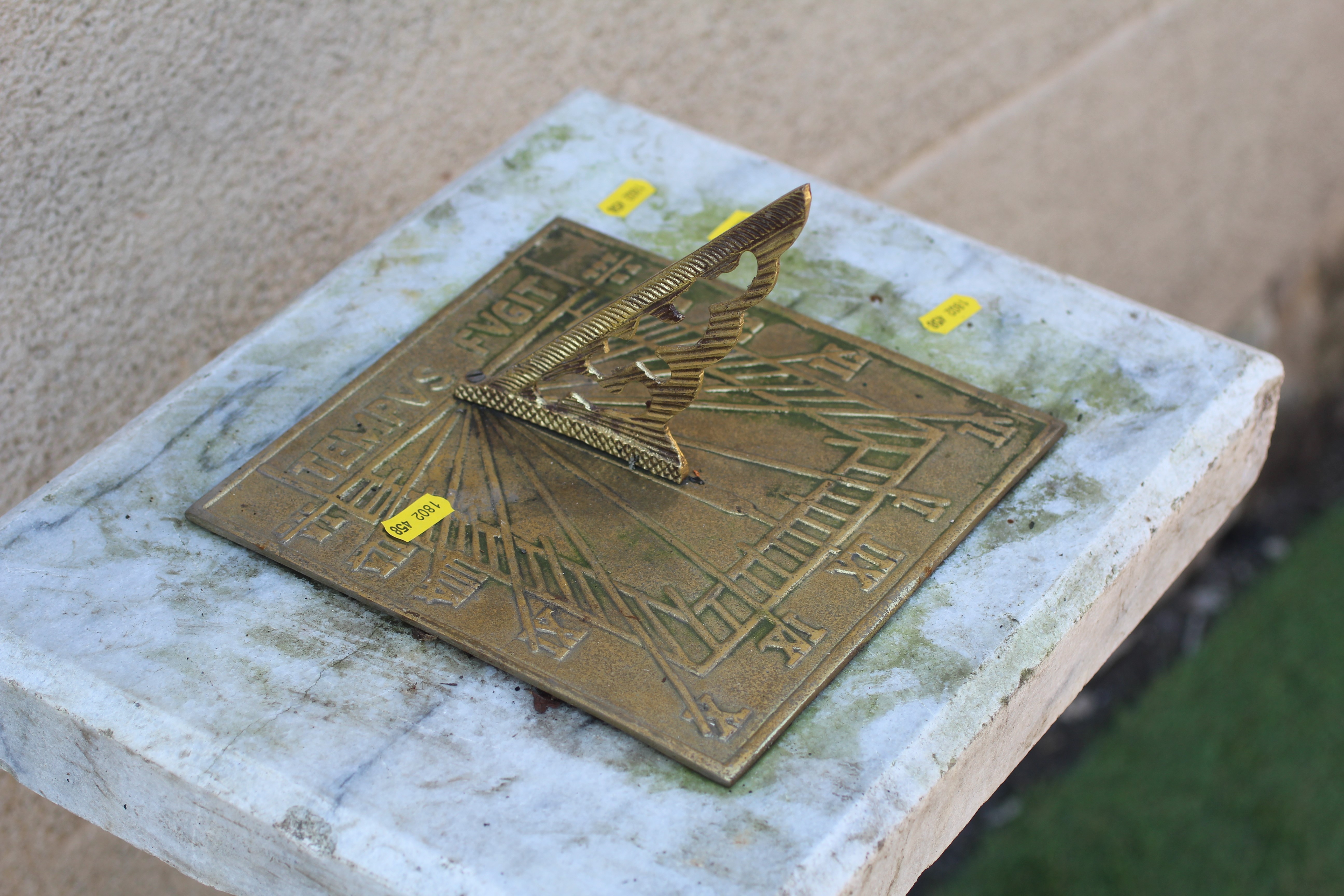 A WHITE MARBLE SQUARE SUNDIAL with baluster turned veined stem and gilded metal gnomon, 15" w x 12" Image