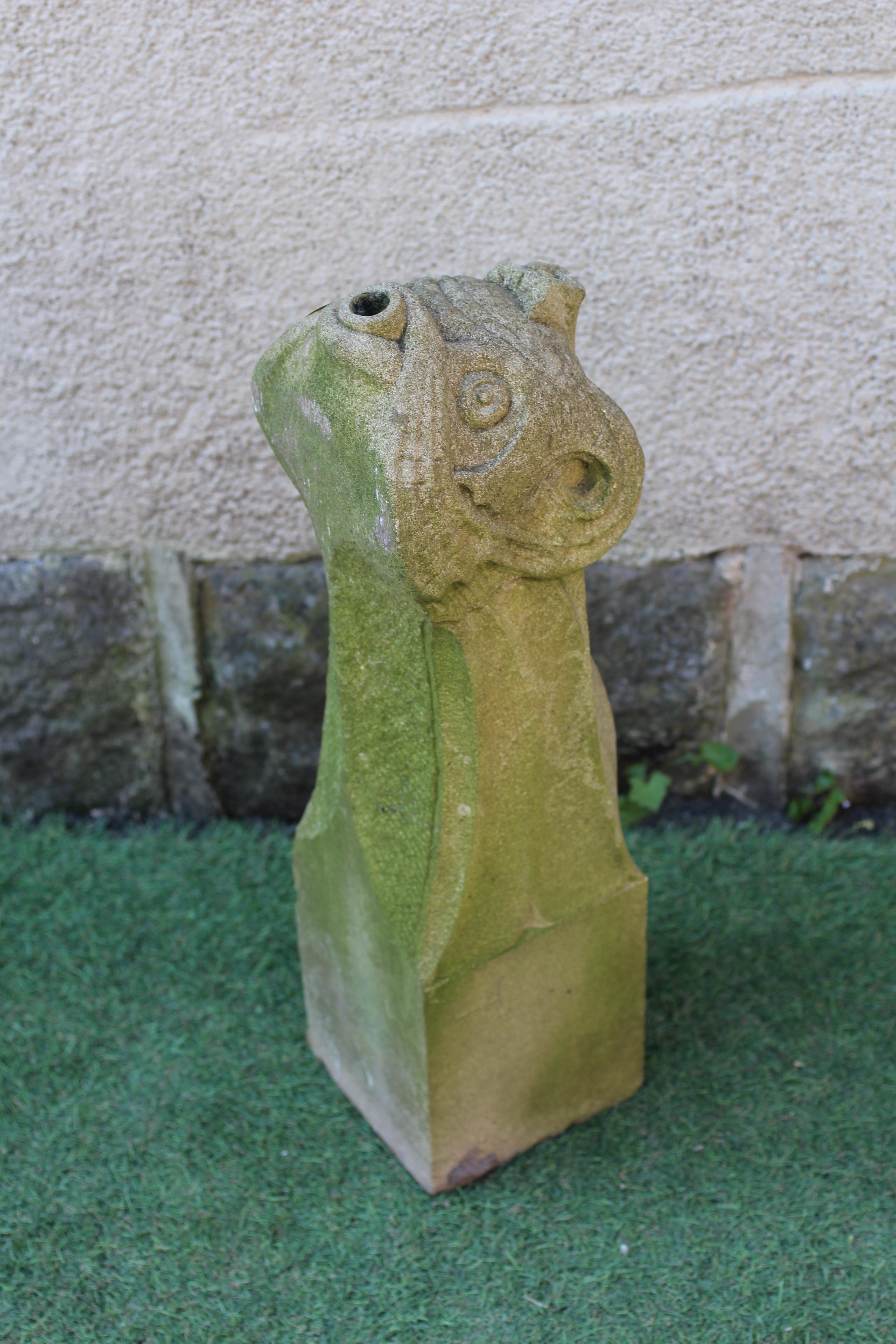 A CARVED SANDSTONE FOUNTAIN SPOUT modelled as the head of a mythical beast, on square base, 23 1/2" Image