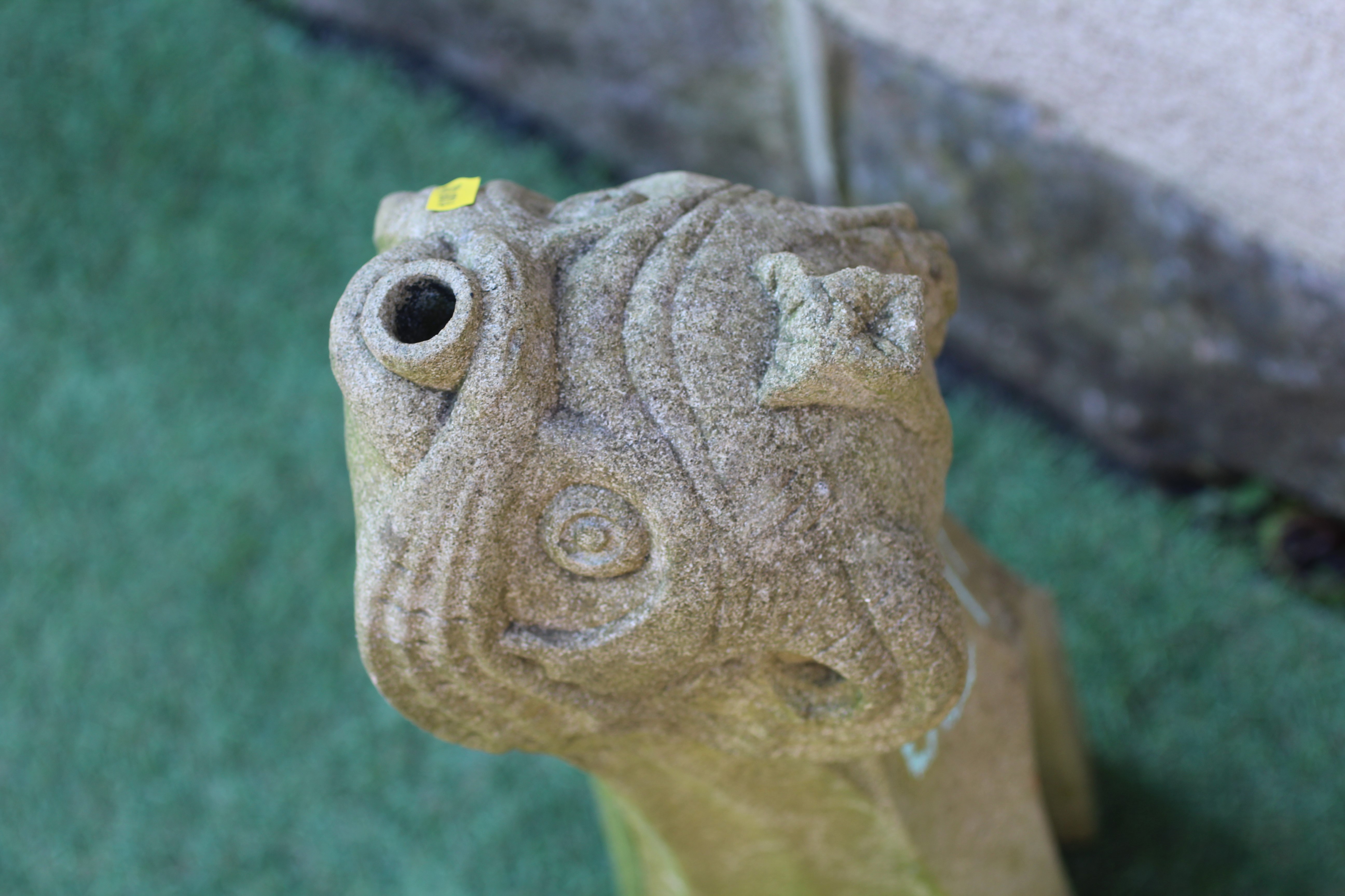 A CARVED SANDSTONE FOUNTAIN SPOUT modelled as the head of a mythical beast, on square base, 23 1/2" Image