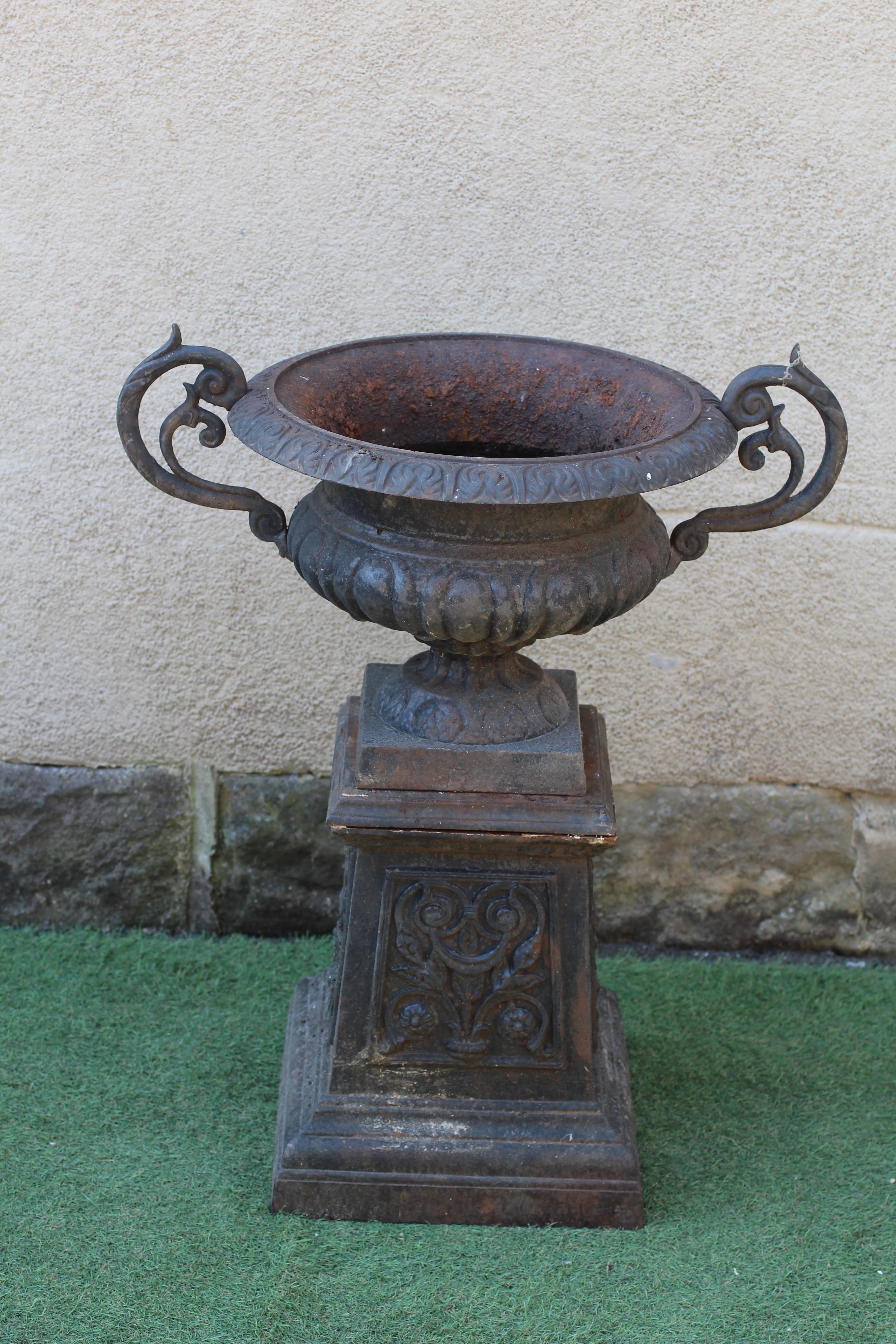 A VICTORIAN CAST IRON PEDESTAL URN Image