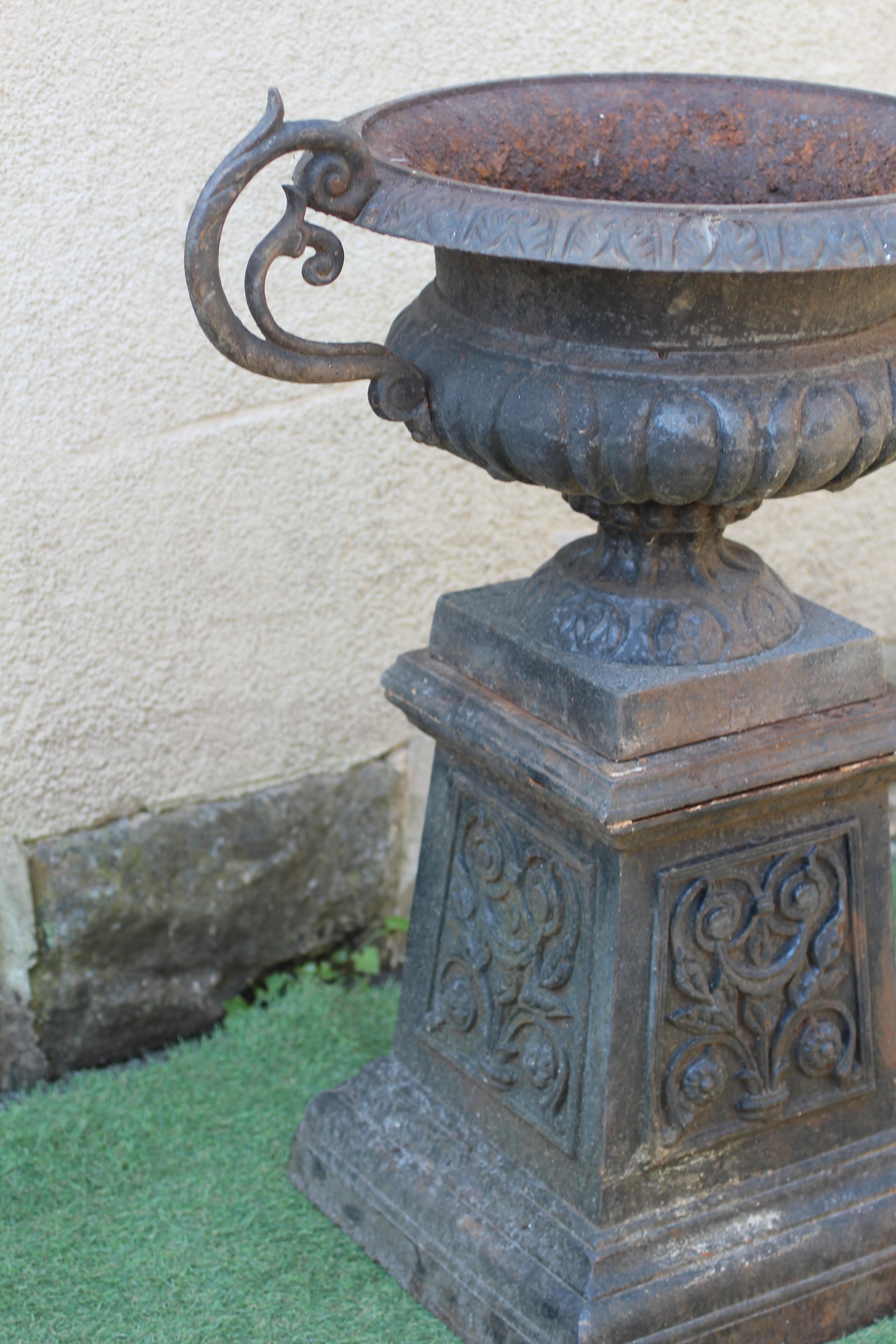 A VICTORIAN CAST IRON PEDESTAL URN Image