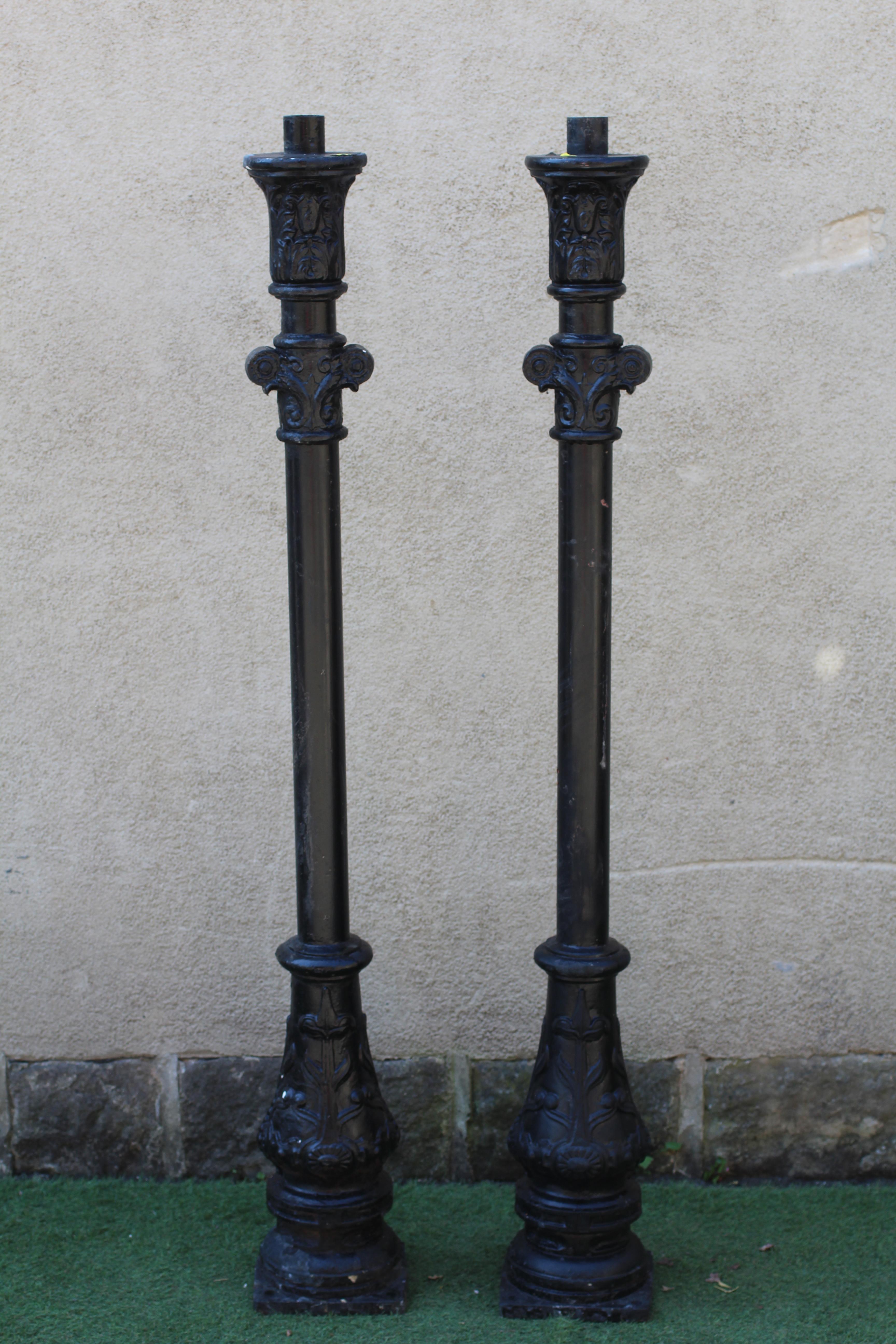 A PAIR OF VICTORIAN STYLE CAST ALLOY LAMP POSTS, lacking hoods, the tubular stem with leaf and Image