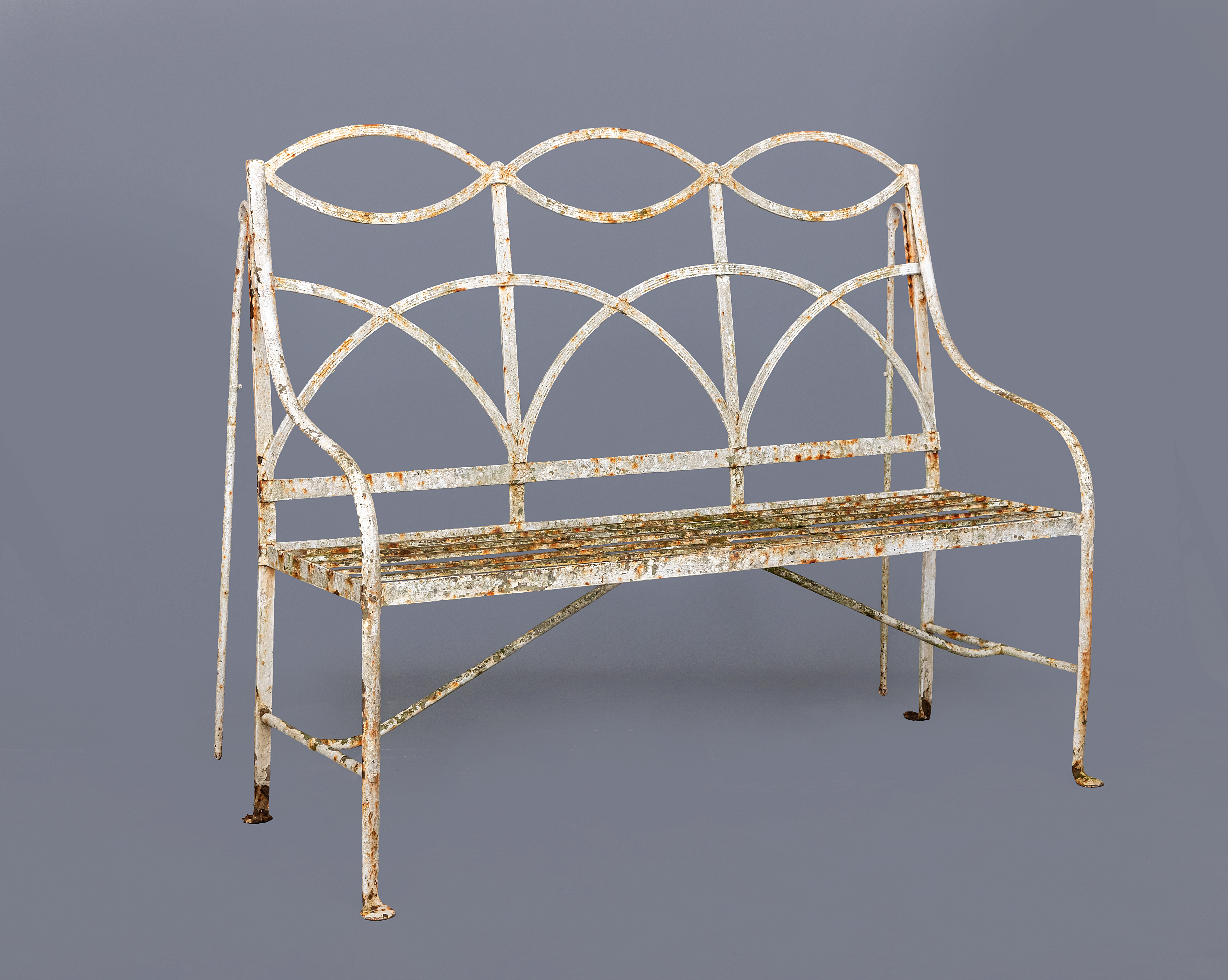 A REGENCY DESIGN REEDED STRAPWORK WROUGHT IRON BENCH Image