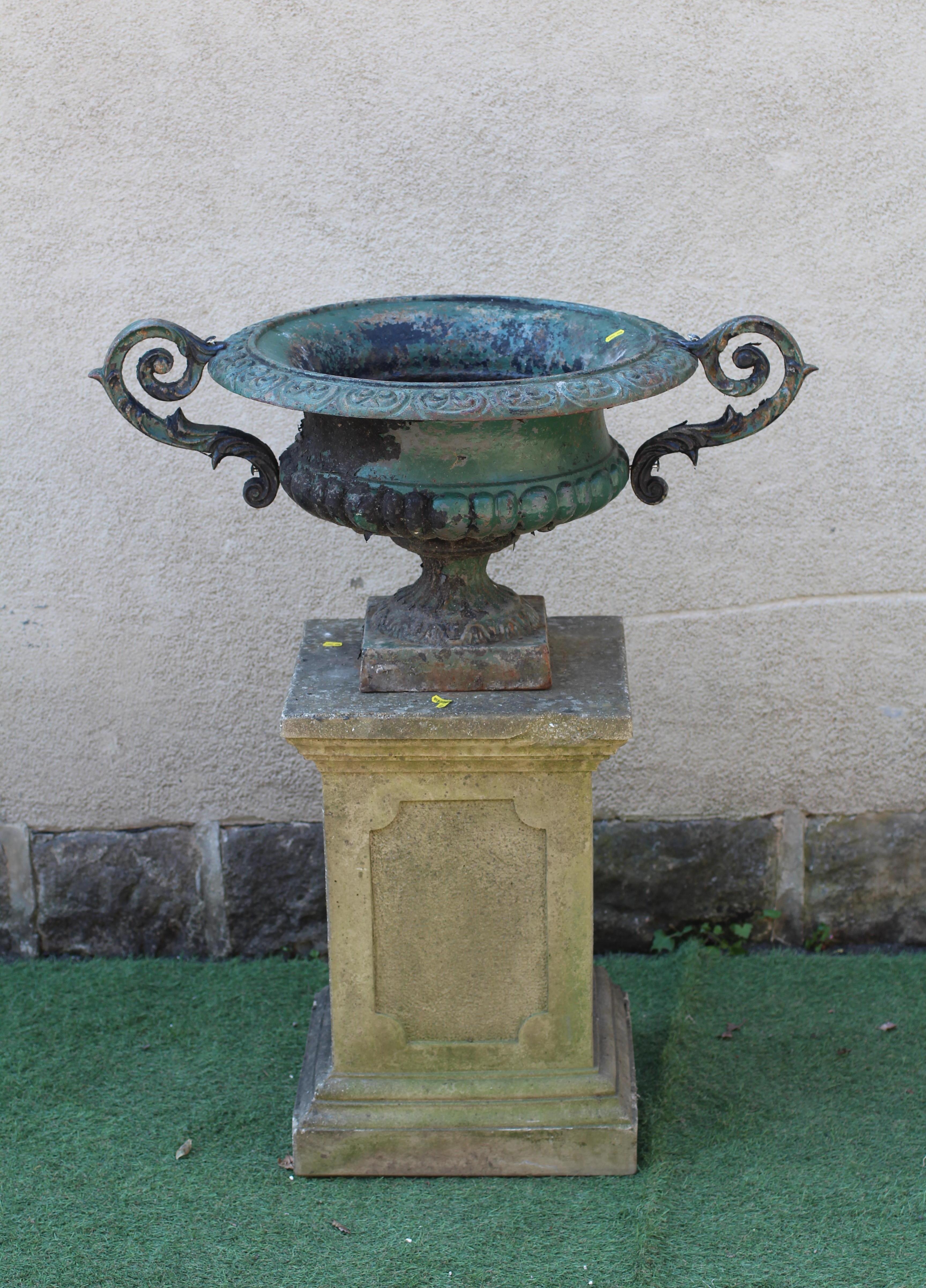 A LARGE VICTORIAN CAST IRON URN of half fluted campana form with scroll moulded rim and pierced Image