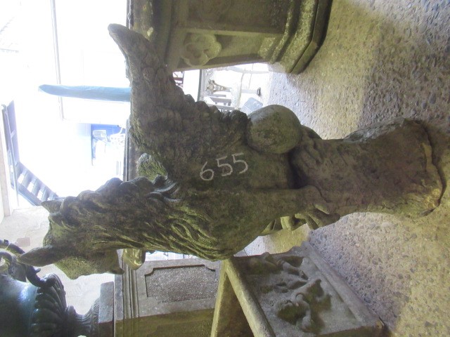 A CAST STONE GRIFFIN modelled with outstretched wings, on domed base, 16" w x 29 1/2" h Image