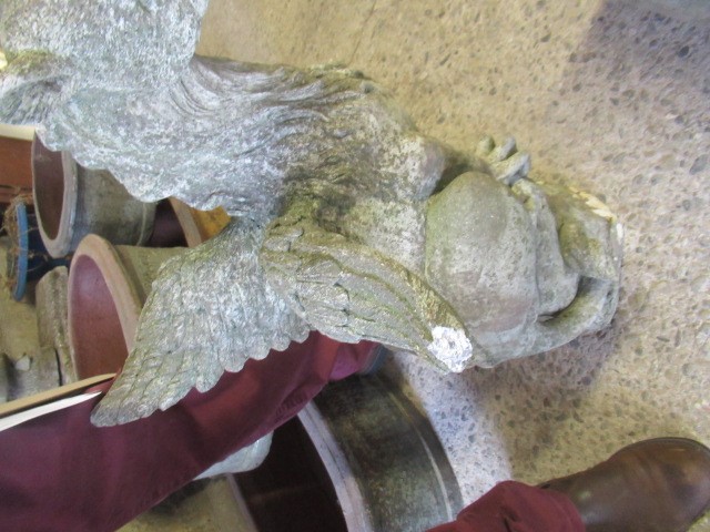 A CAST STONE GRIFFIN modelled with outstretched wings, on domed base, 16" w x 29 1/2" h Image