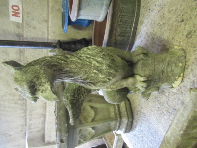 A CAST STONE GRIFFIN modelled with outstretched wings, on domed base, 16" w x 29 1/2" h Image