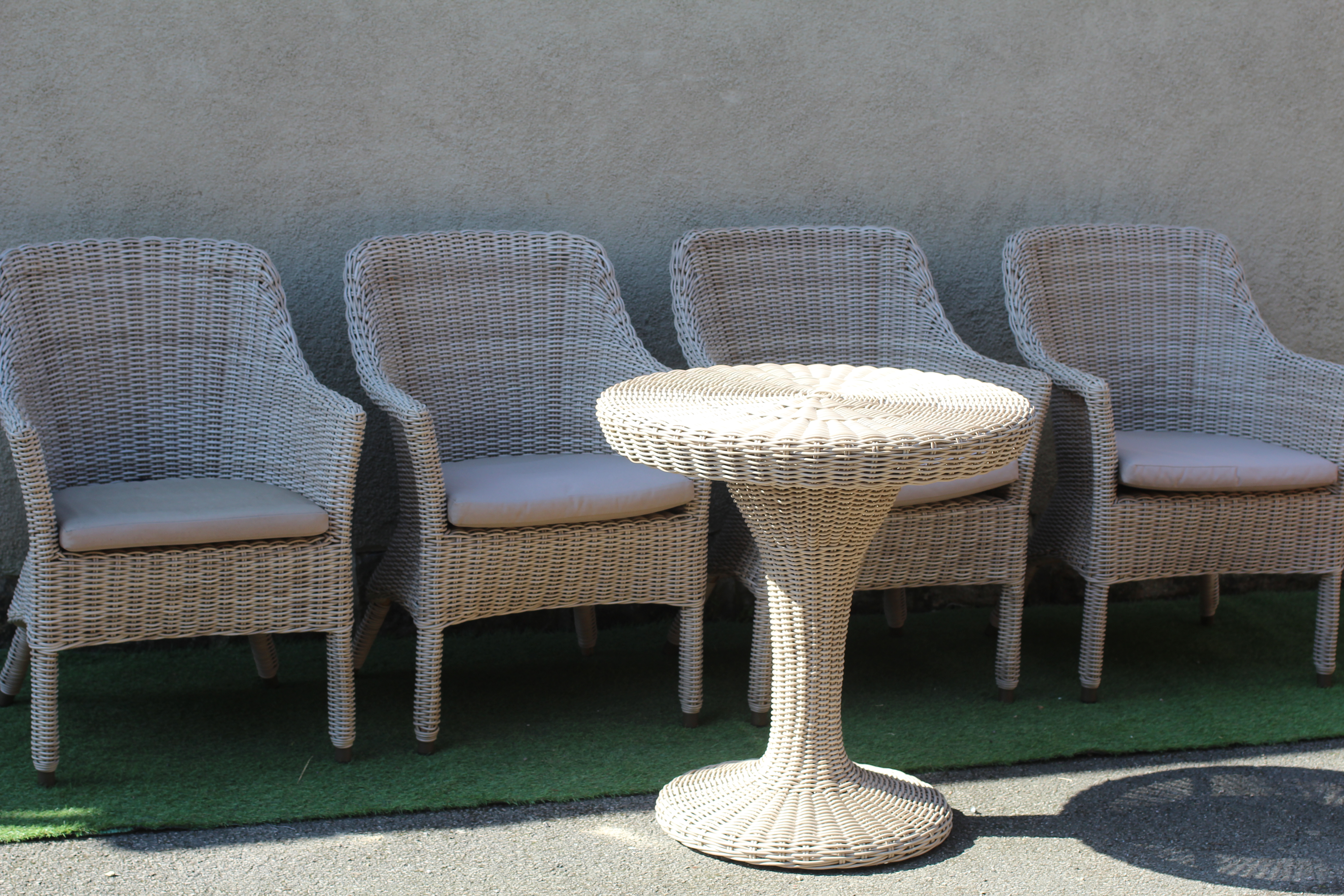 A SET OF FOUR ALUMINIUM FRAMED WOVEN "WICKER" ARMCHAIRS Image
