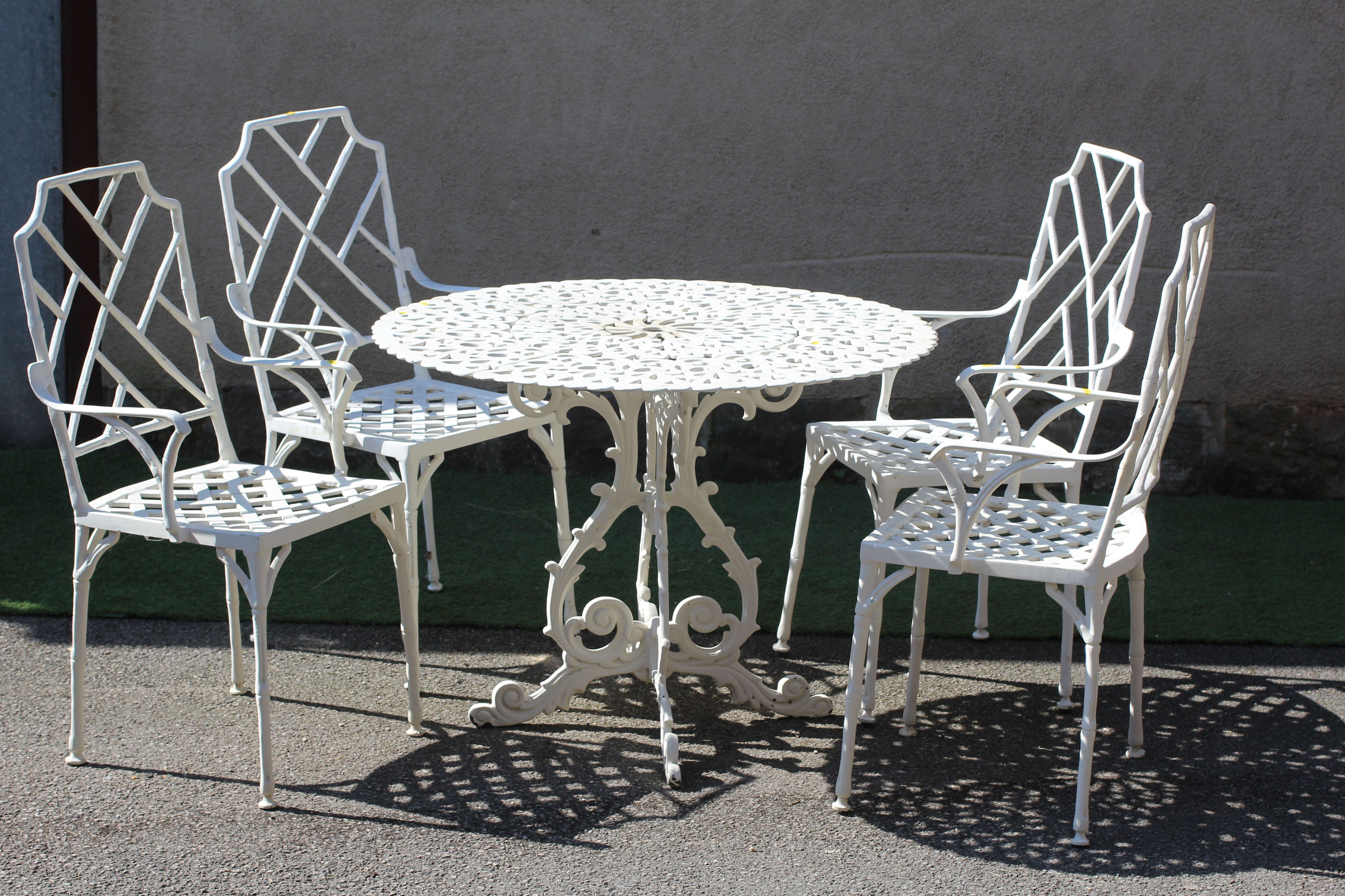 A CAST METAL DINING SUITE Image