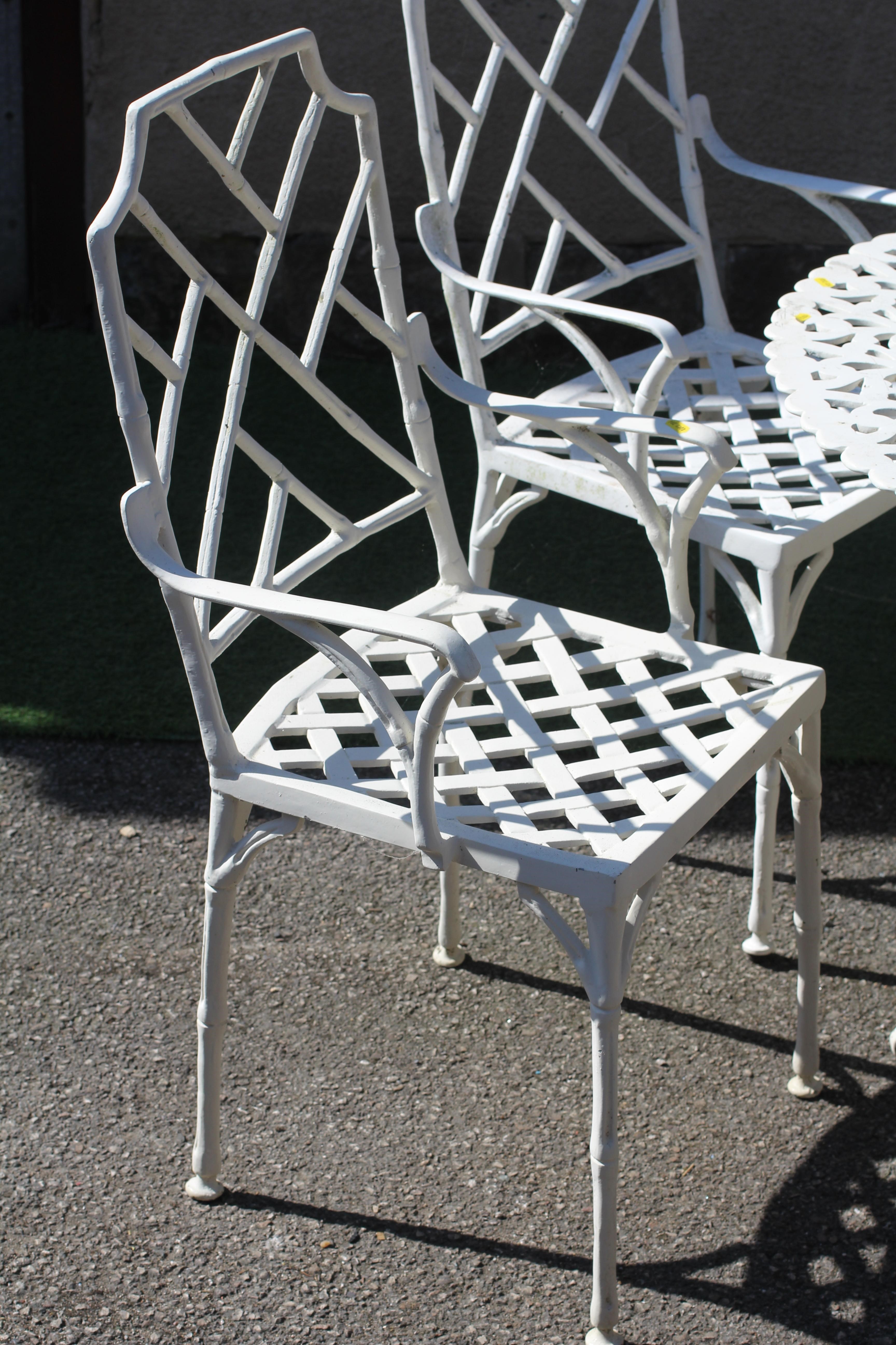 A CAST METAL DINING SUITE Image