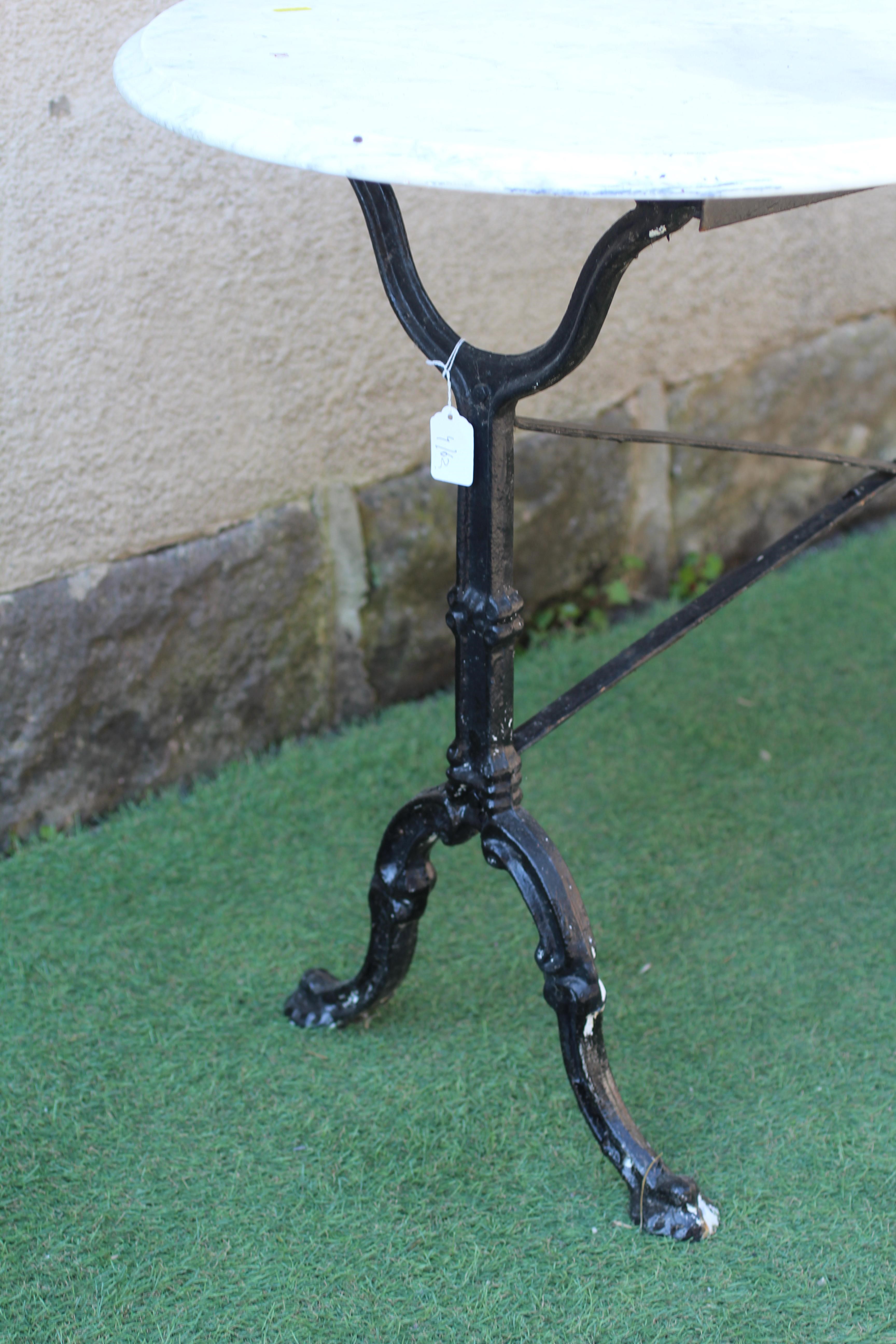A MARBLE AND CAST IRON TABLE Image