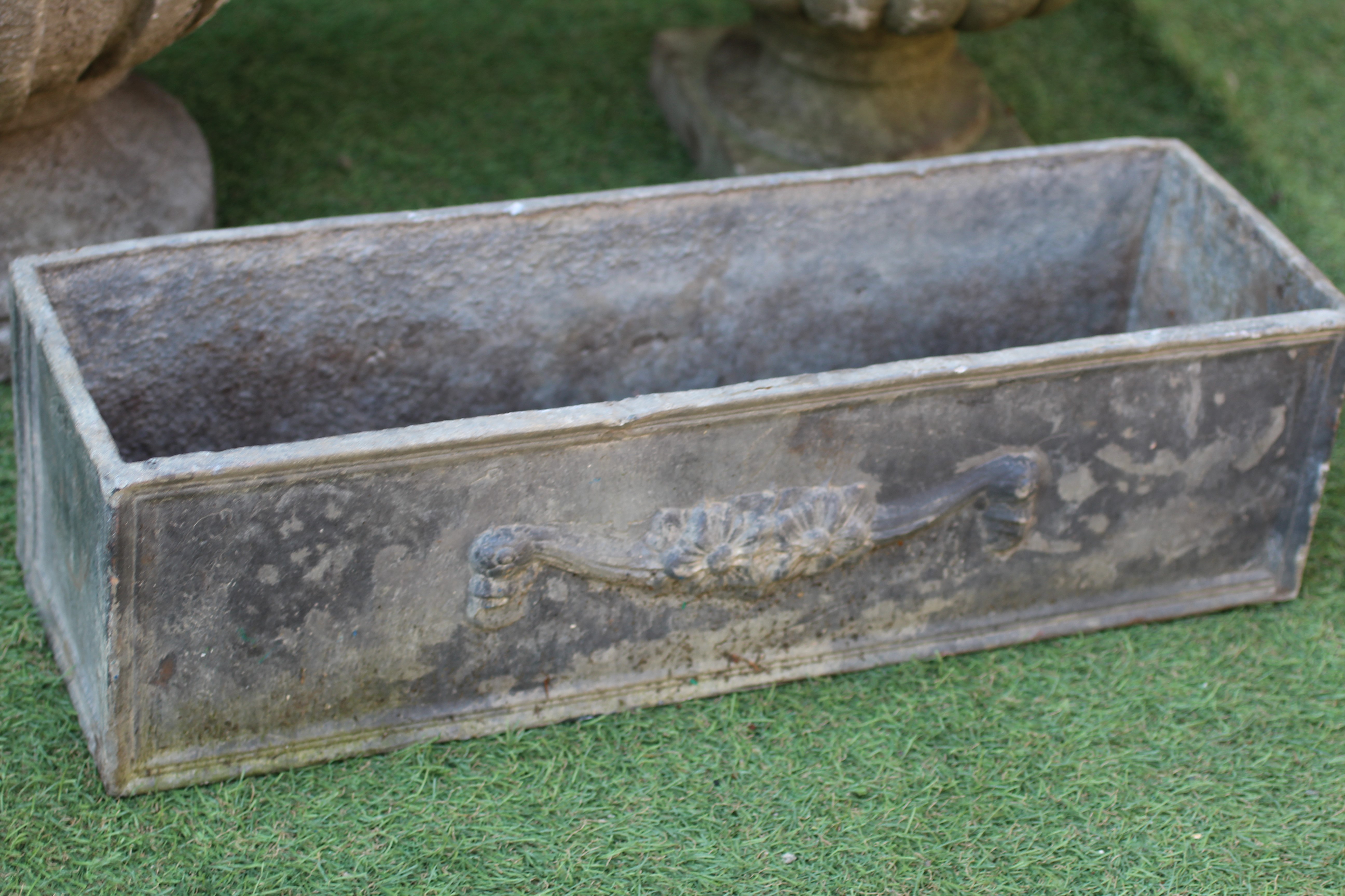 A SMALL LEAD PLANTER of oblong panelled form Image