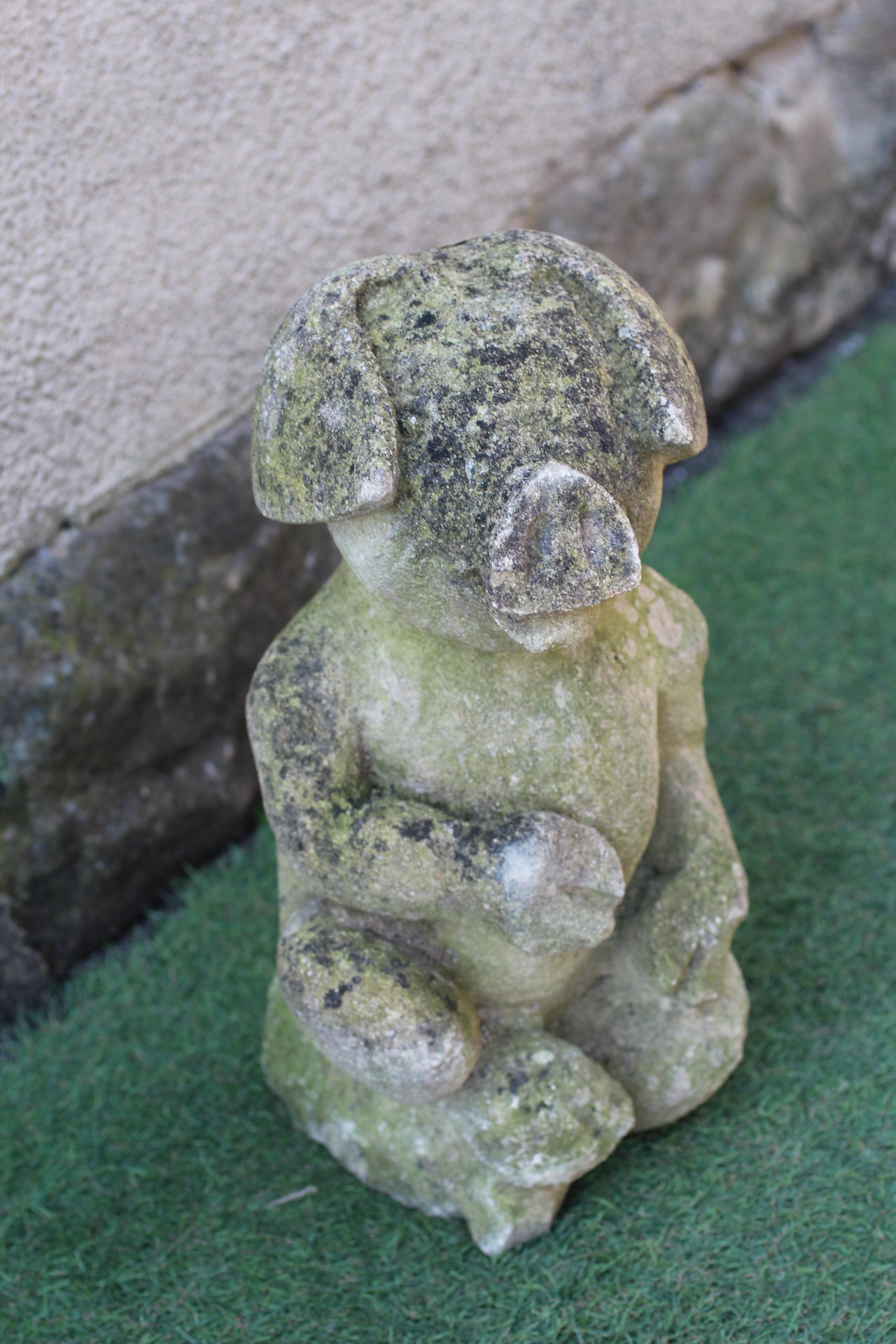 A CARVED SANDSTONE FIGURE OF A SEATED PIG on a square base, 8" w x 16" h Image