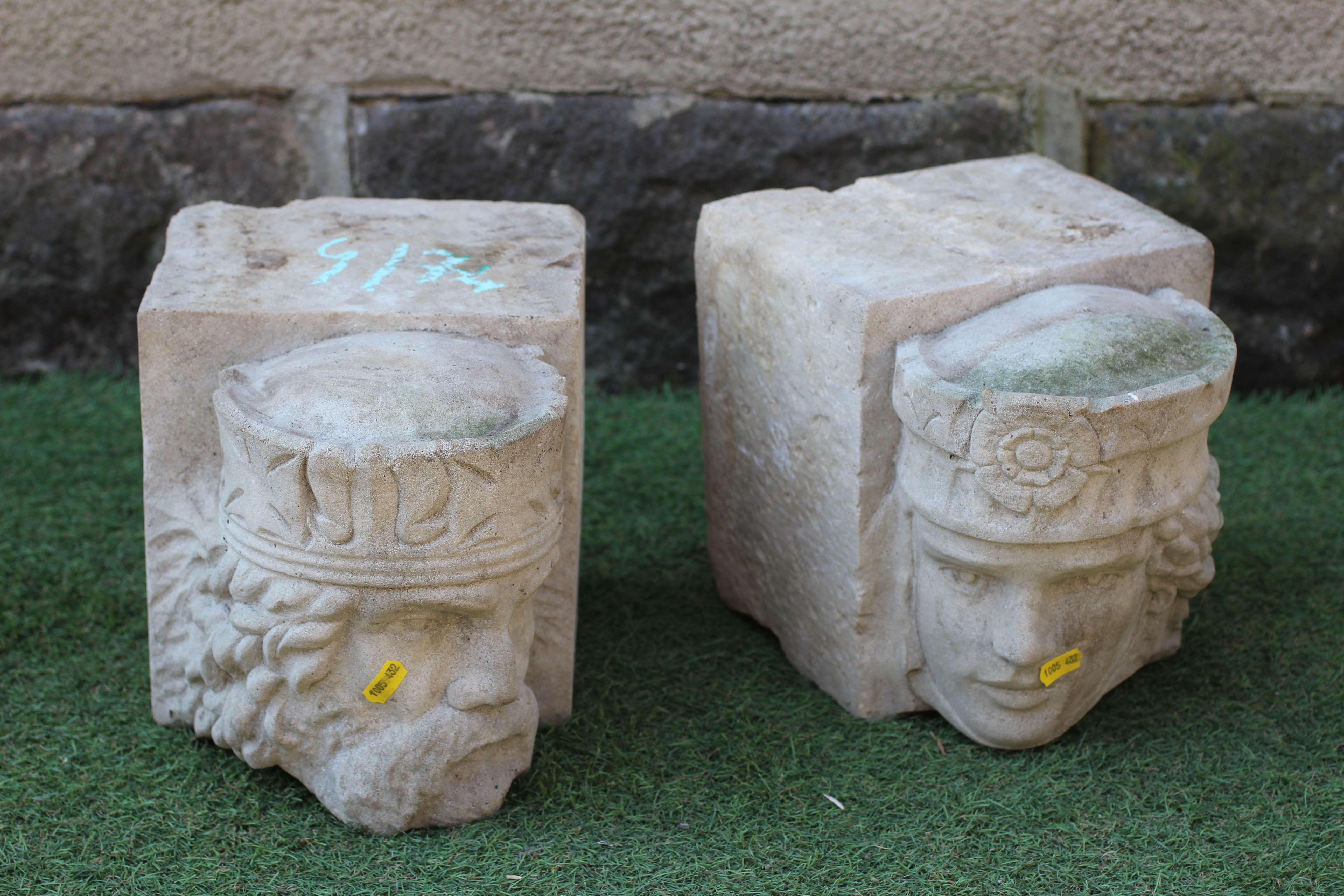 A PAIR OF CAST STONE CORBELS depicting the head of a king and queen, on oblong base, 8 1/2" w x 11 Image