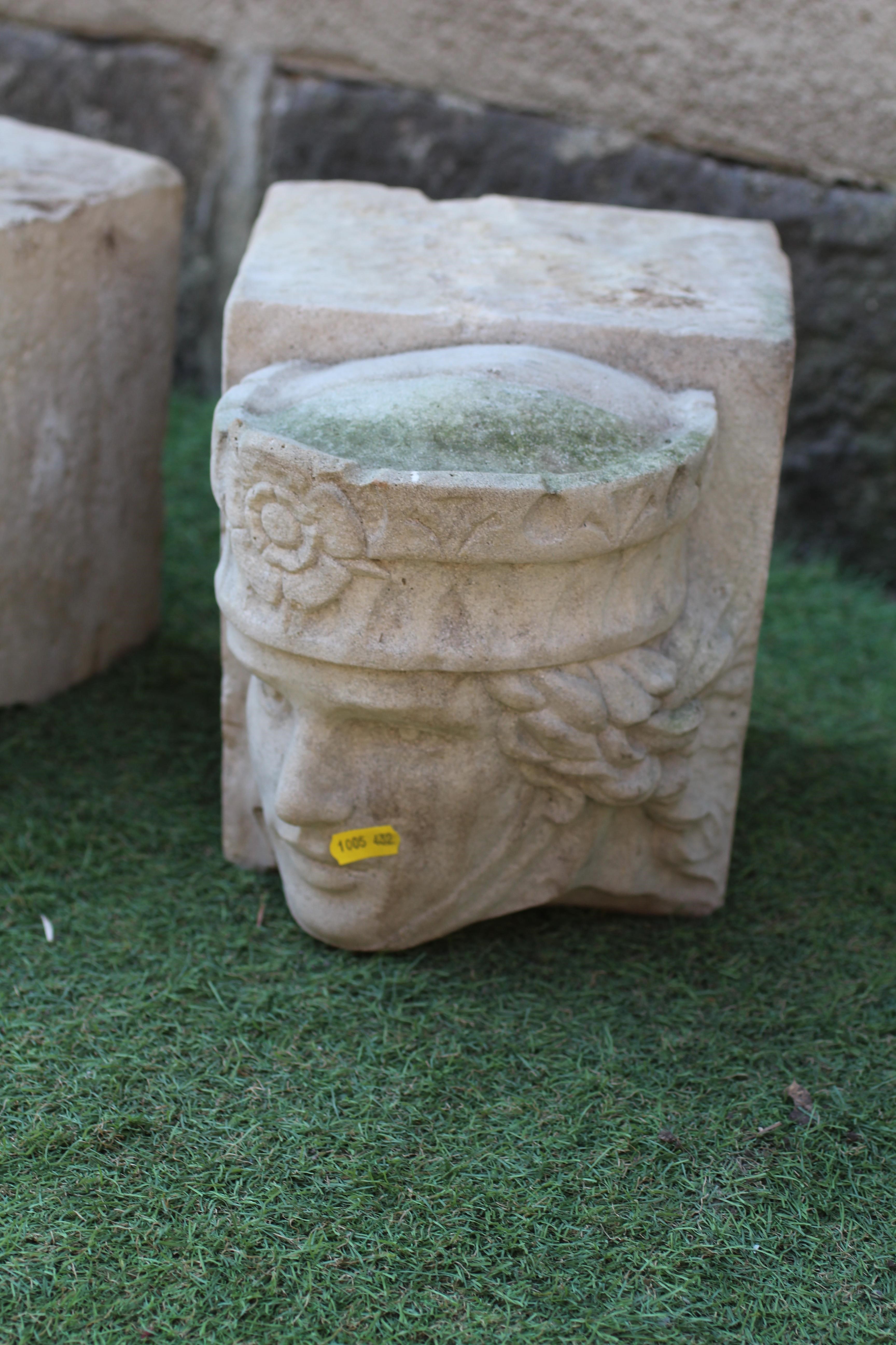 A PAIR OF CAST STONE CORBELS depicting the head of a king and queen, on oblong base, 8 1/2" w x 11 Image