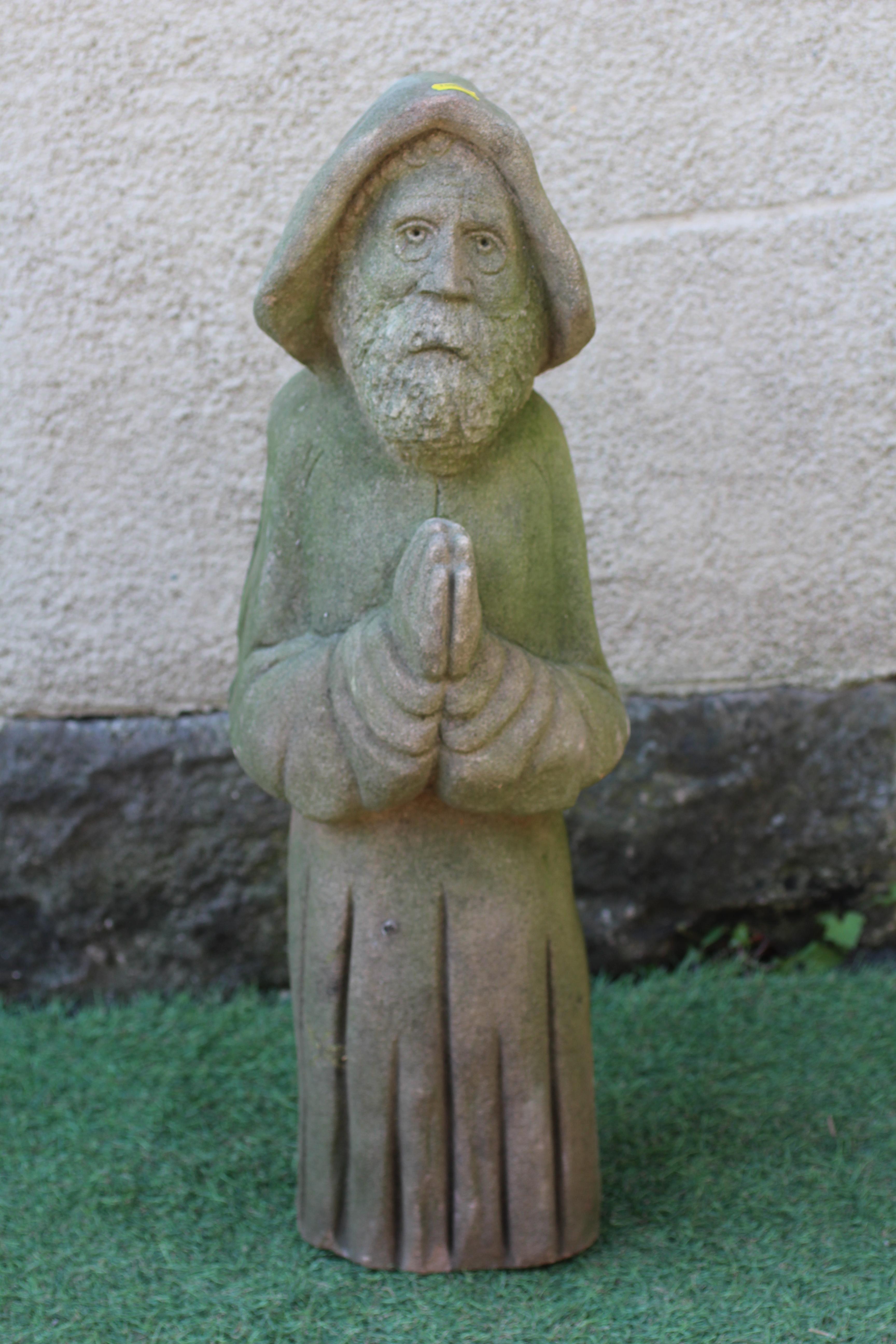 A CARVED SANDSTONE FIGURE OF A MONK, 19th century, modelled standing with hands joined in prayer, 8" Image