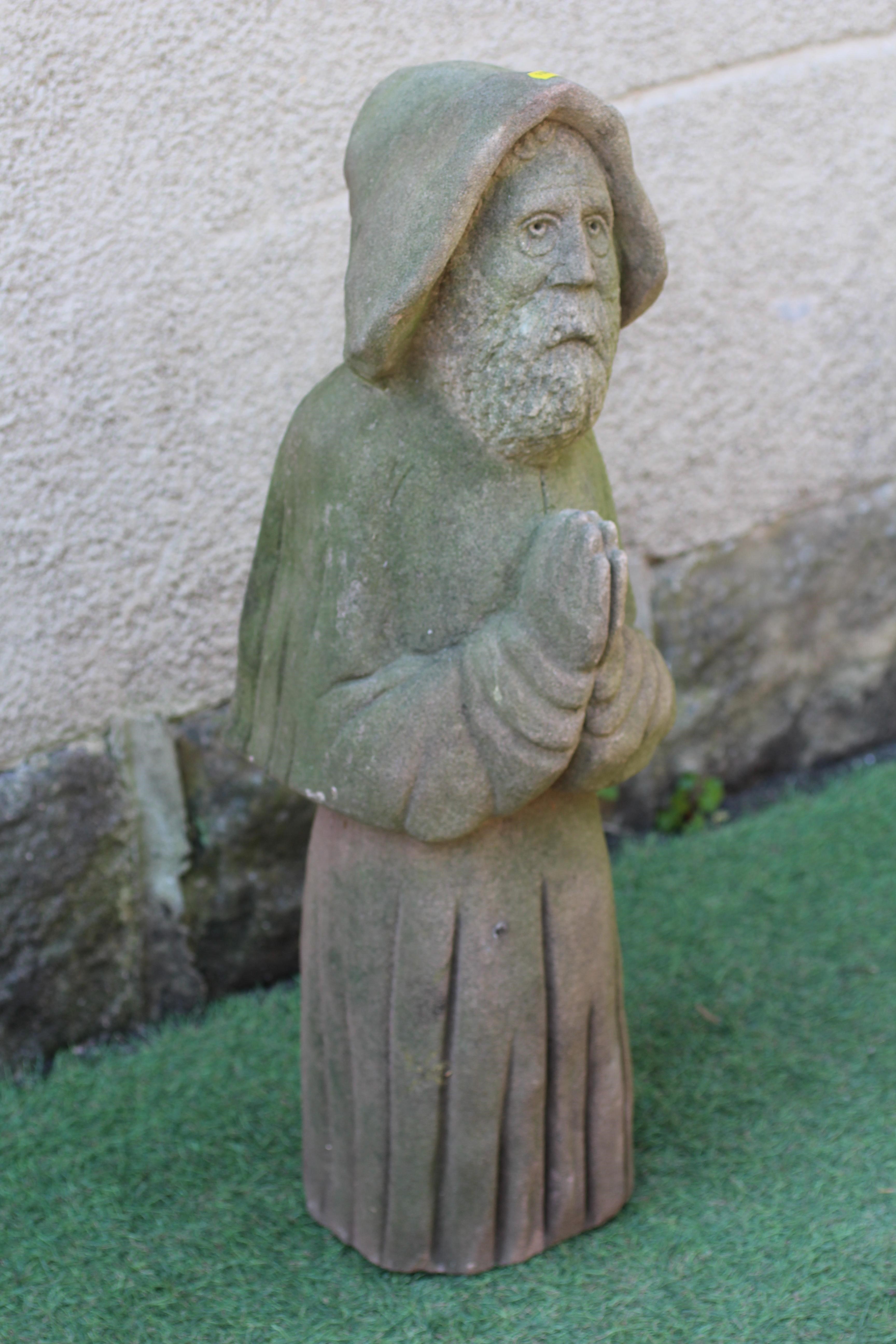 A CARVED SANDSTONE FIGURE OF A MONK, 19th century, modelled standing with hands joined in prayer, 8" Image