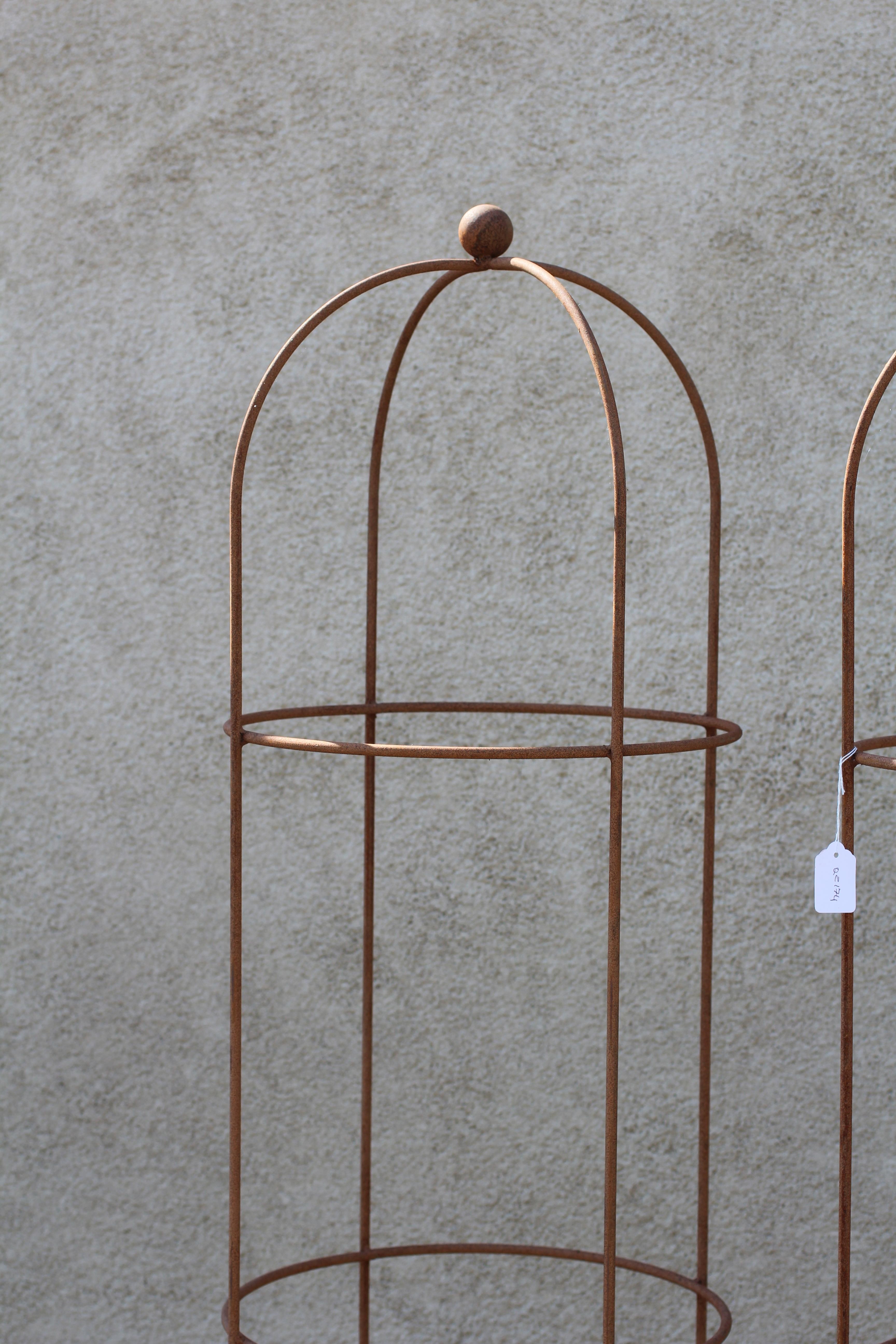 A PAIR OF RUSTED METAL CONICAL ROSE OBELISKS, the domed top with ball finial, 15" w x 80" h Image