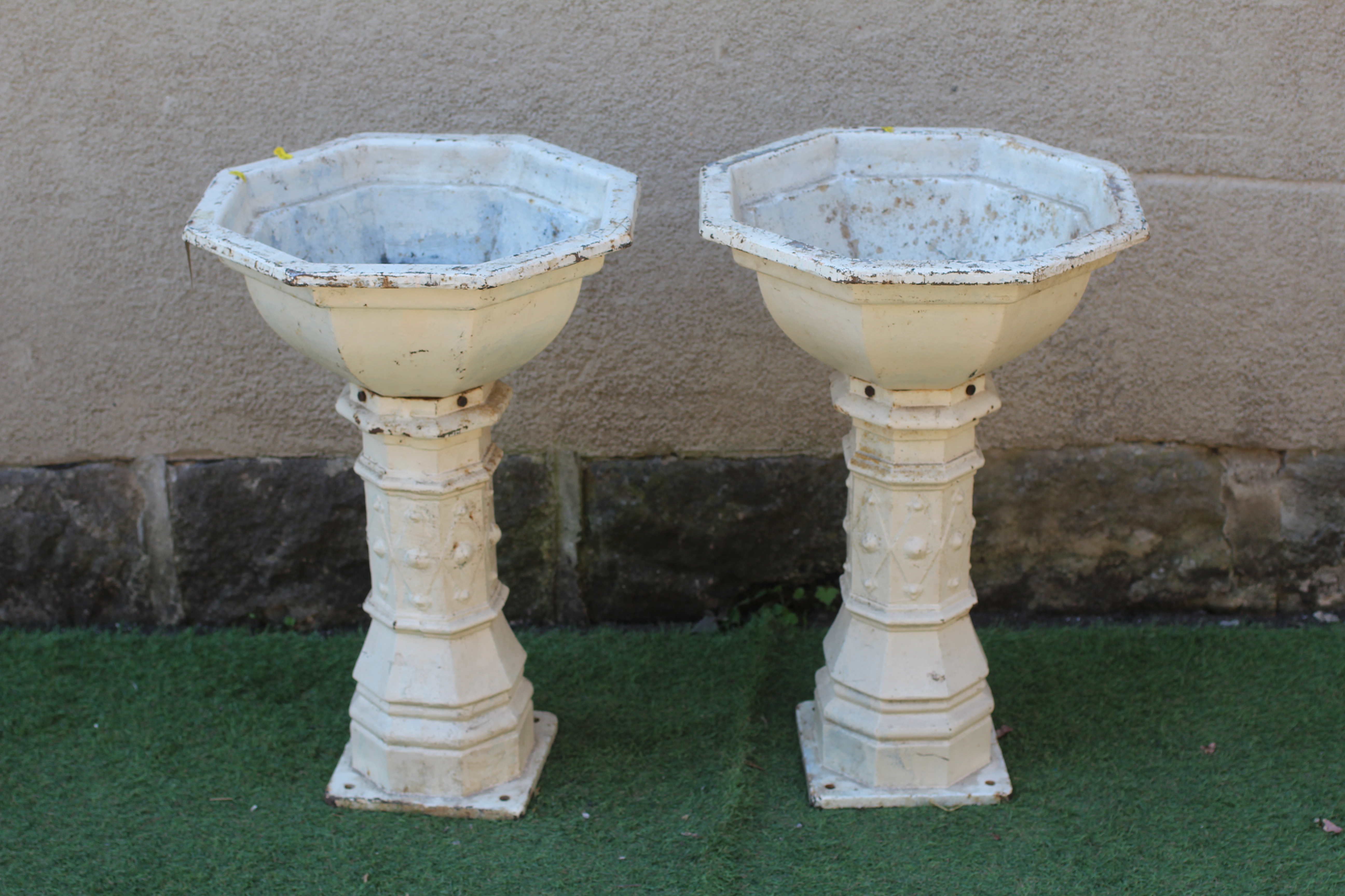 A PAIR OF VICTORIAN GOTHIC CAST IRON OCTAGONAL PLANTERS, the plain bowl on faceted diamond banded Image