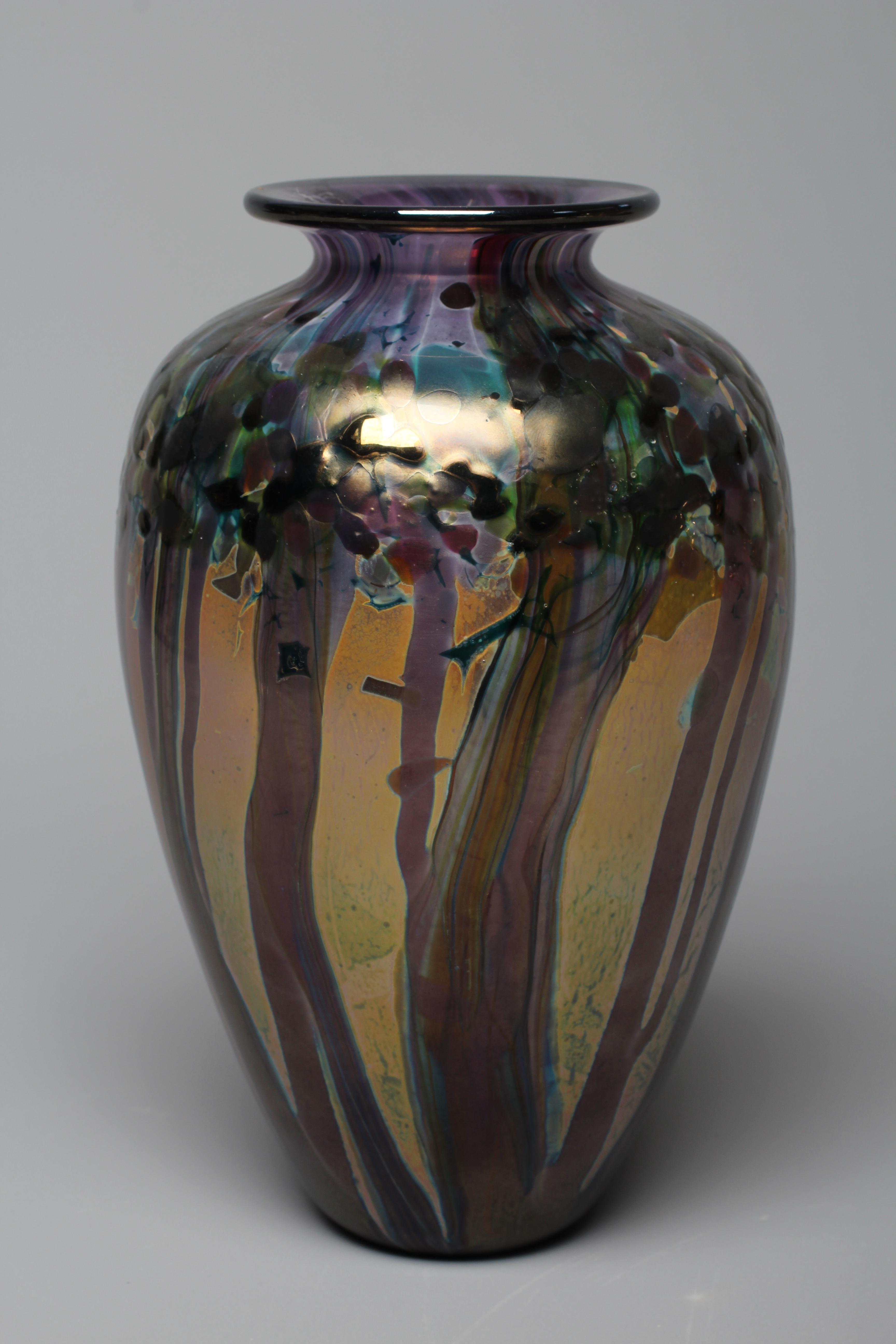 A JONATHAN HARRIS PURPLE GLASS MONSOON VASE, 2001, of tapering ovoid form with peacock iridescent Image