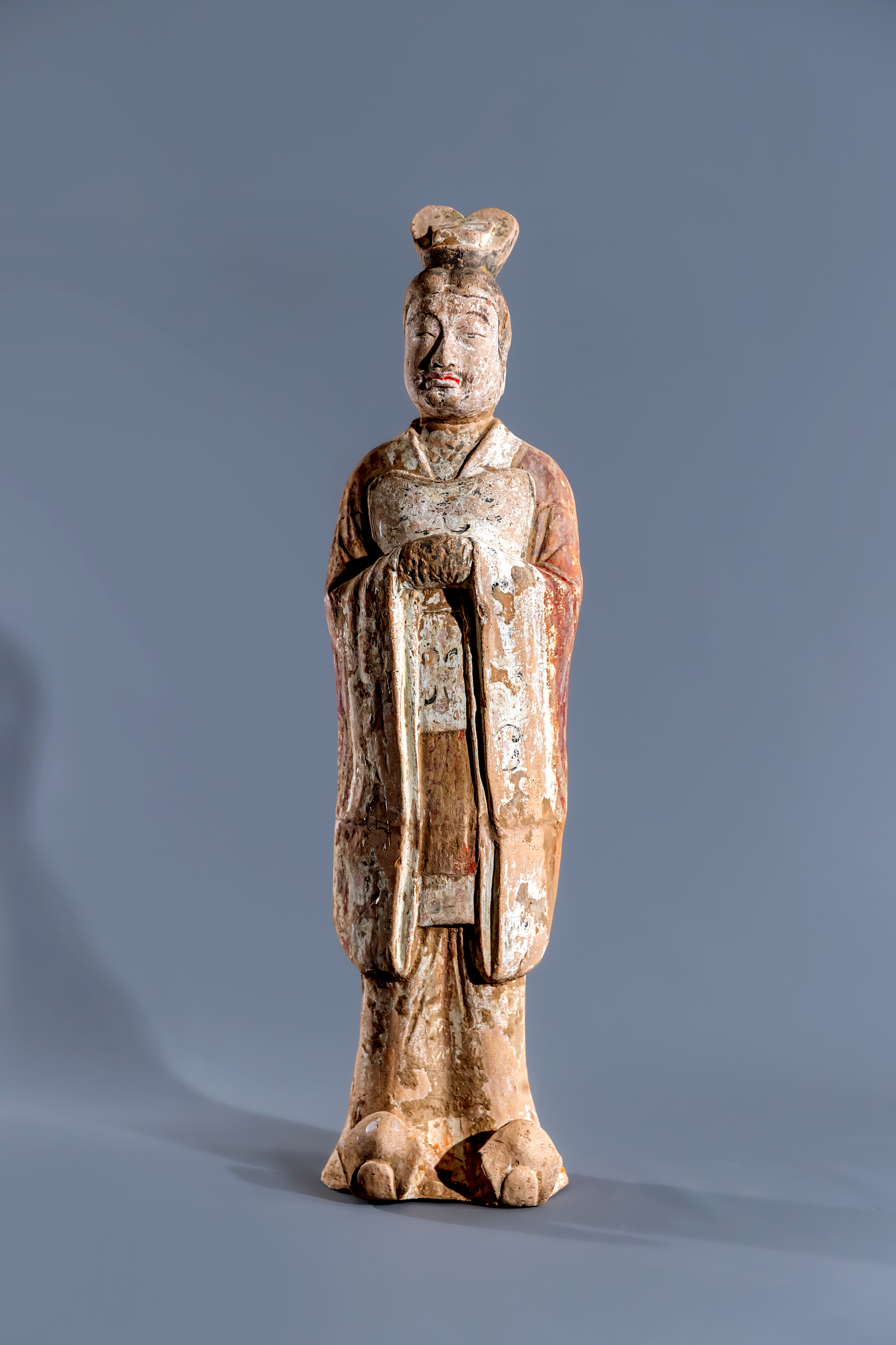 A CHINESE TANG DYNASTY TERRACOTTA COURT OFFICIAL standing with clasped hands Image