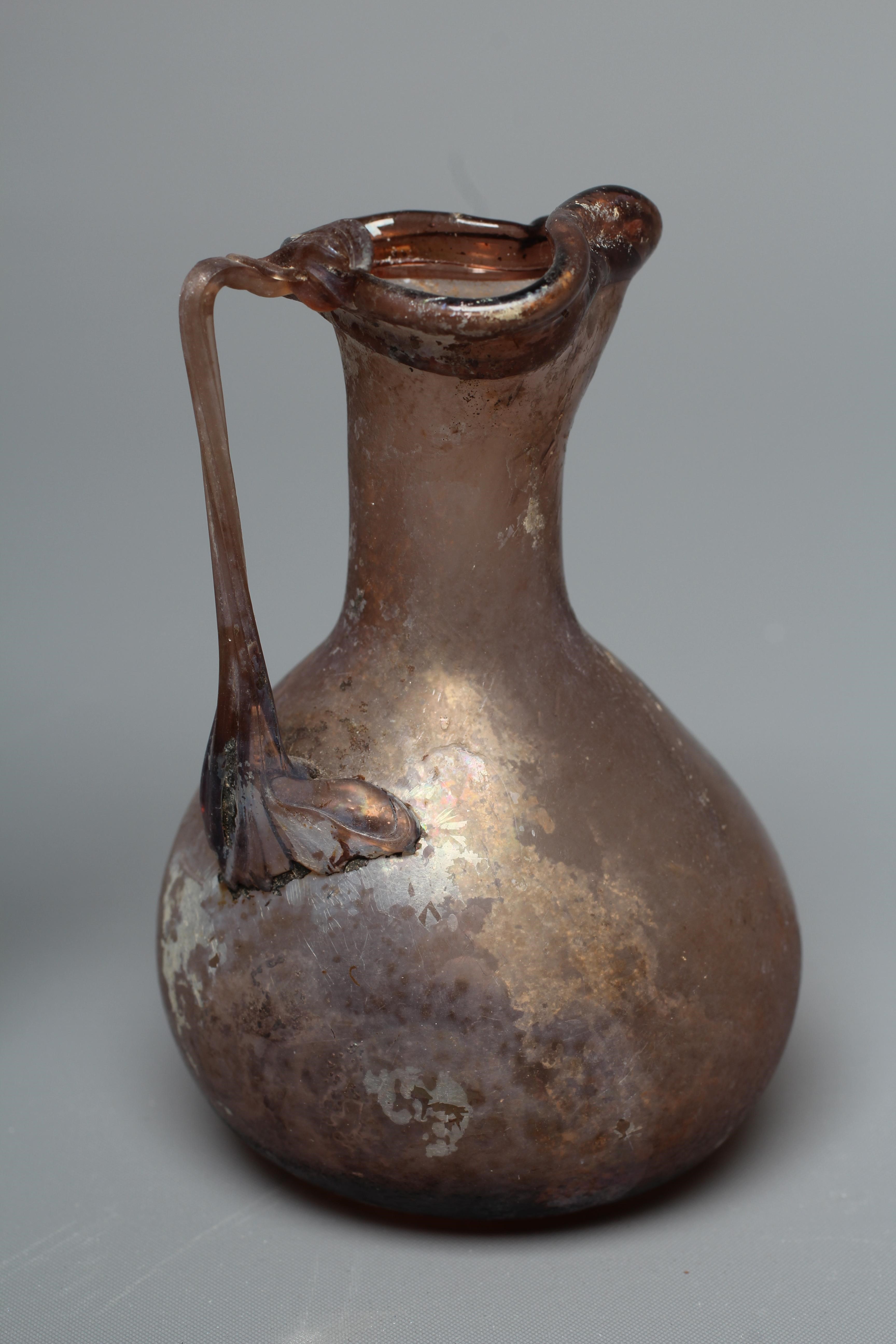 A ROMAN AUBERGINE GLASS JUG Image