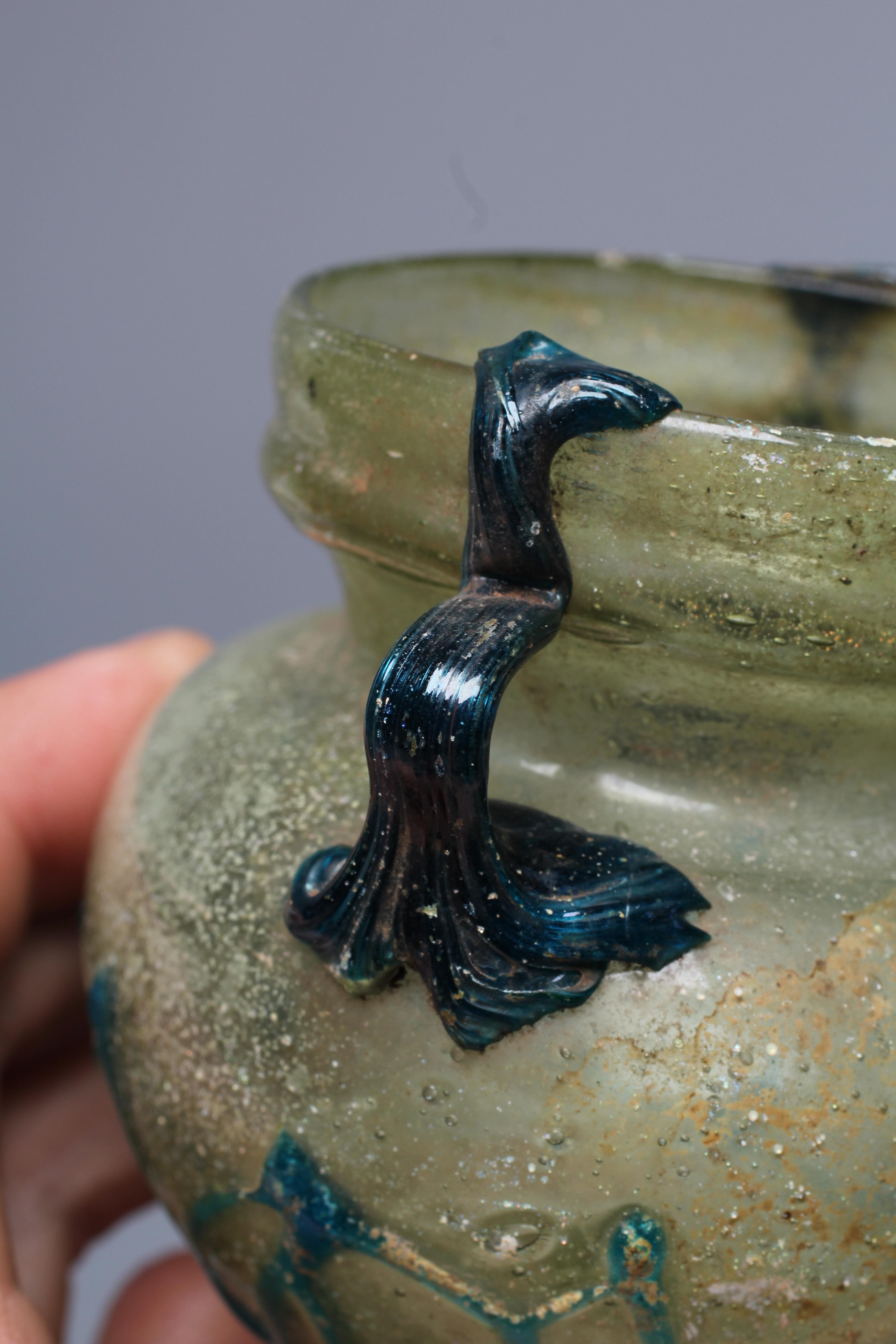 A ROMAN PALE GREEN GLASS BEAKER TYPE BOWL Image