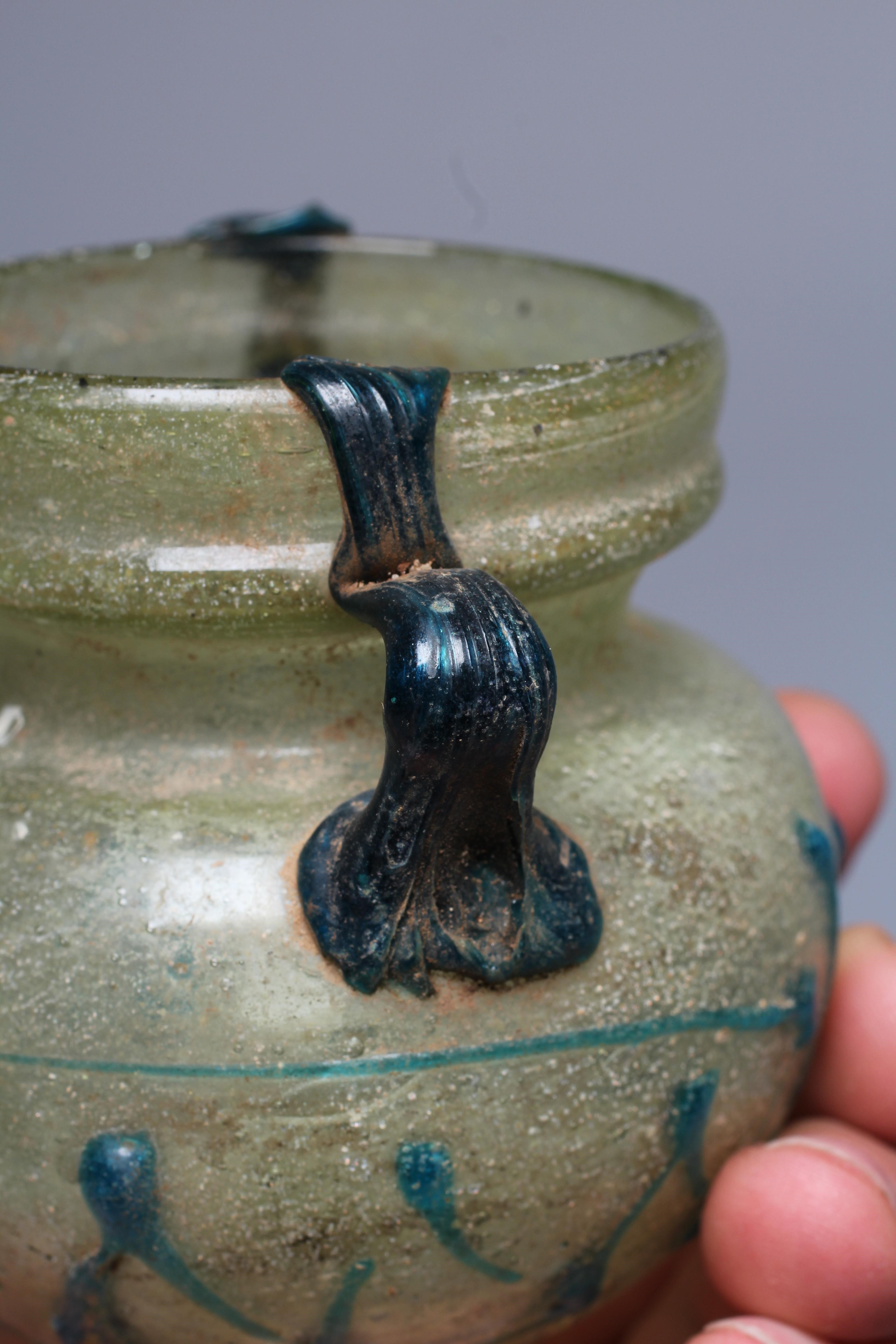 A ROMAN PALE GREEN GLASS BEAKER TYPE BOWL Image