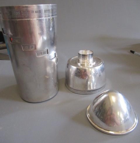 AN ART DECO TORPEDO SHAPED RECIPE COCKTAIL SHAKER by Wilhelm Wolf, the rim with fifteen named Image