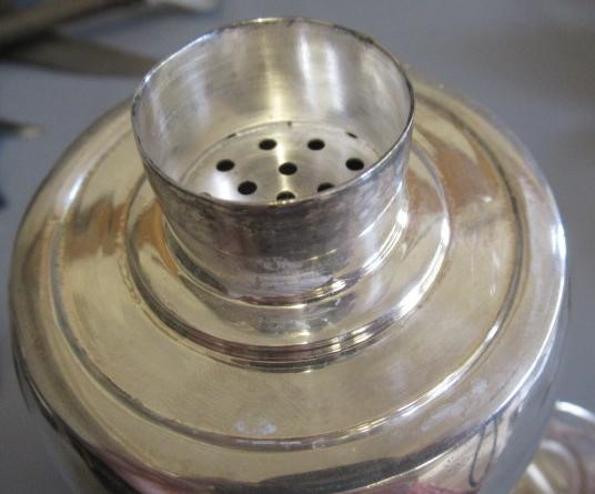 AN ART DECO TORPEDO SHAPED RECIPE COCKTAIL SHAKER by Wilhelm Wolf, the rim with fifteen named Image