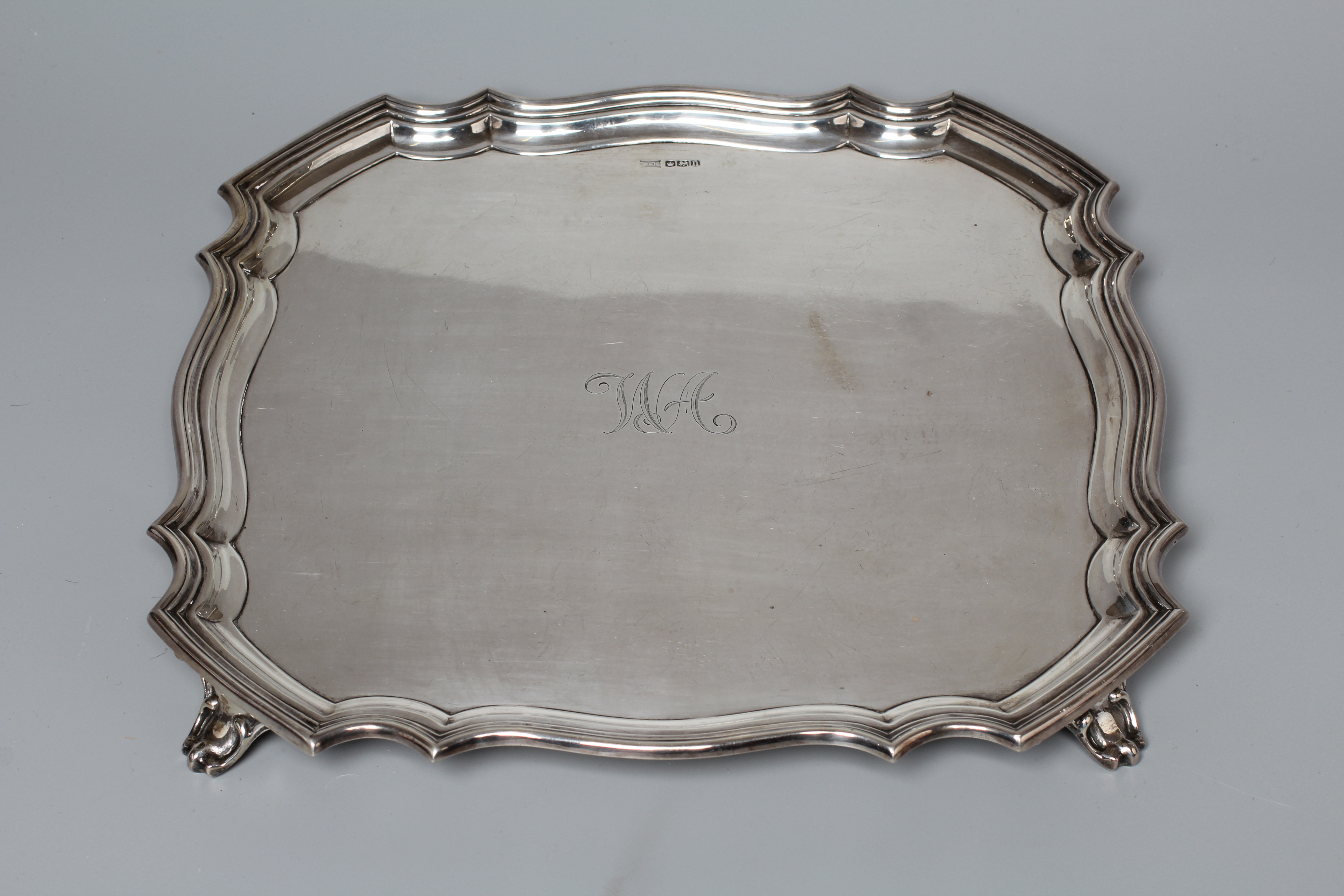 A GEORGE V SALVER by Walker & Hall, Sheffield 1930, of shaped square form with piecrust border, Image