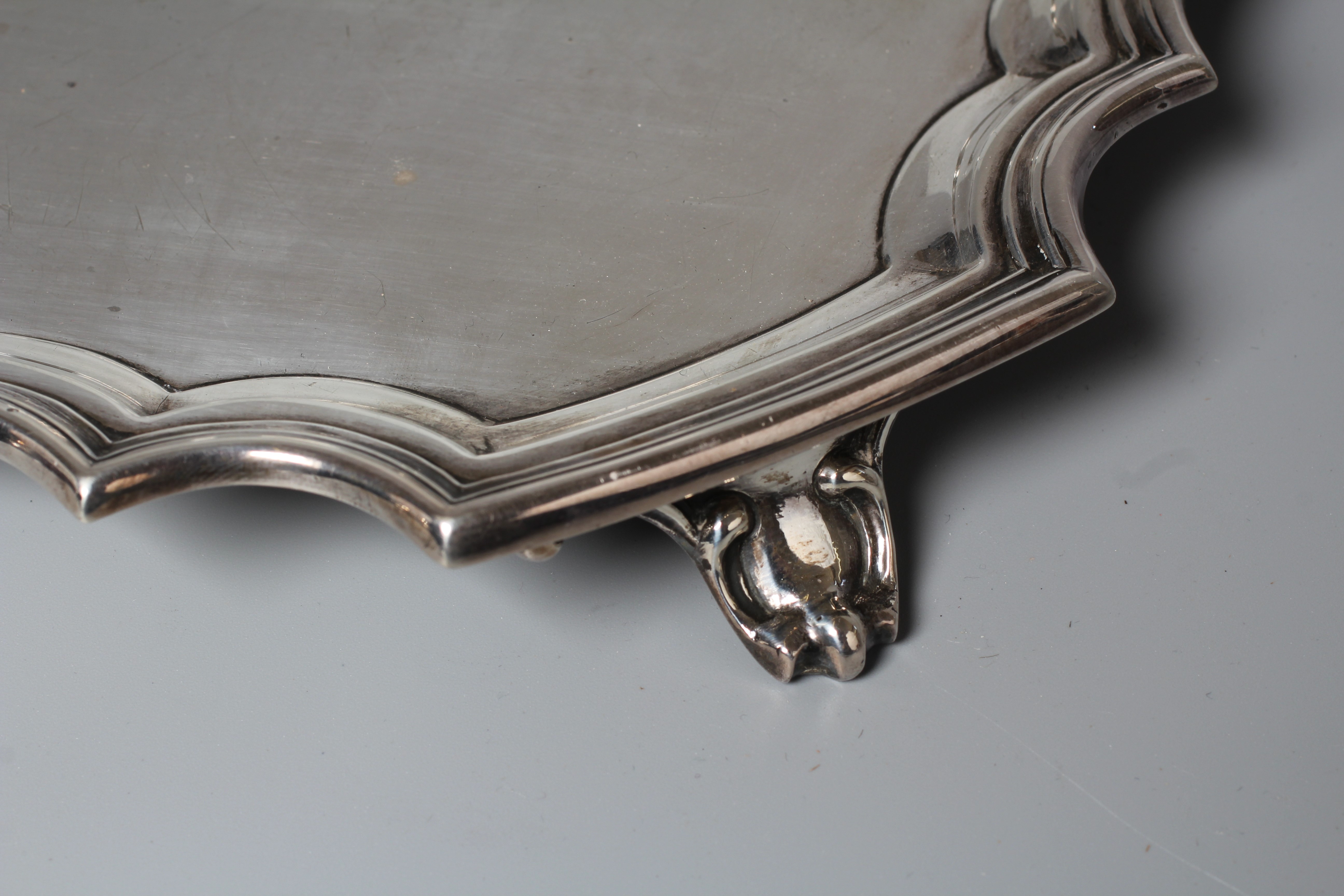 A GEORGE V SALVER by Walker & Hall, Sheffield 1930, of shaped square form with piecrust border, Image