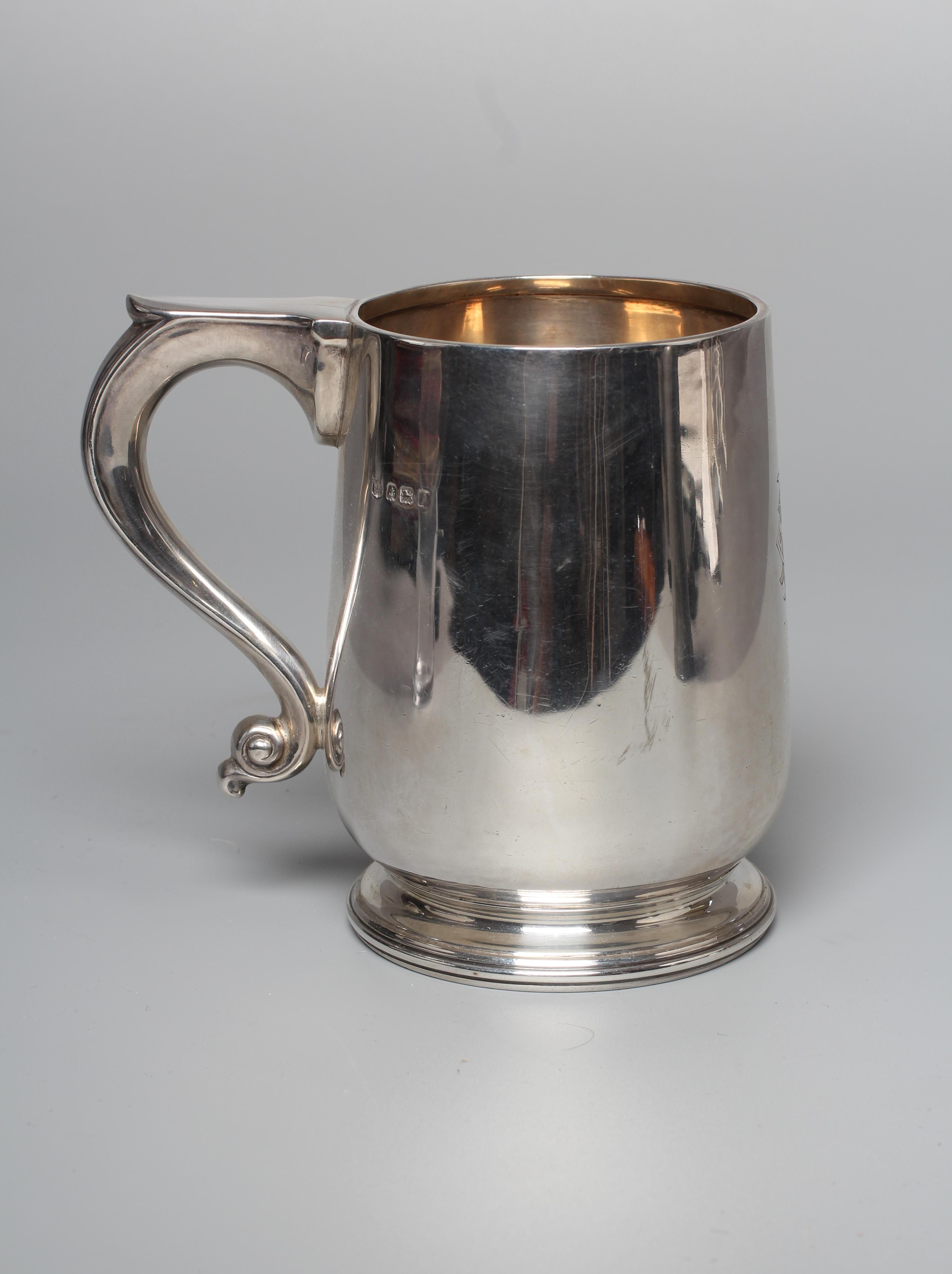 A GEORGE V MUG by William Neale & Son Ltd., Birmingham 1925, of rounded cylindrical form with S Image