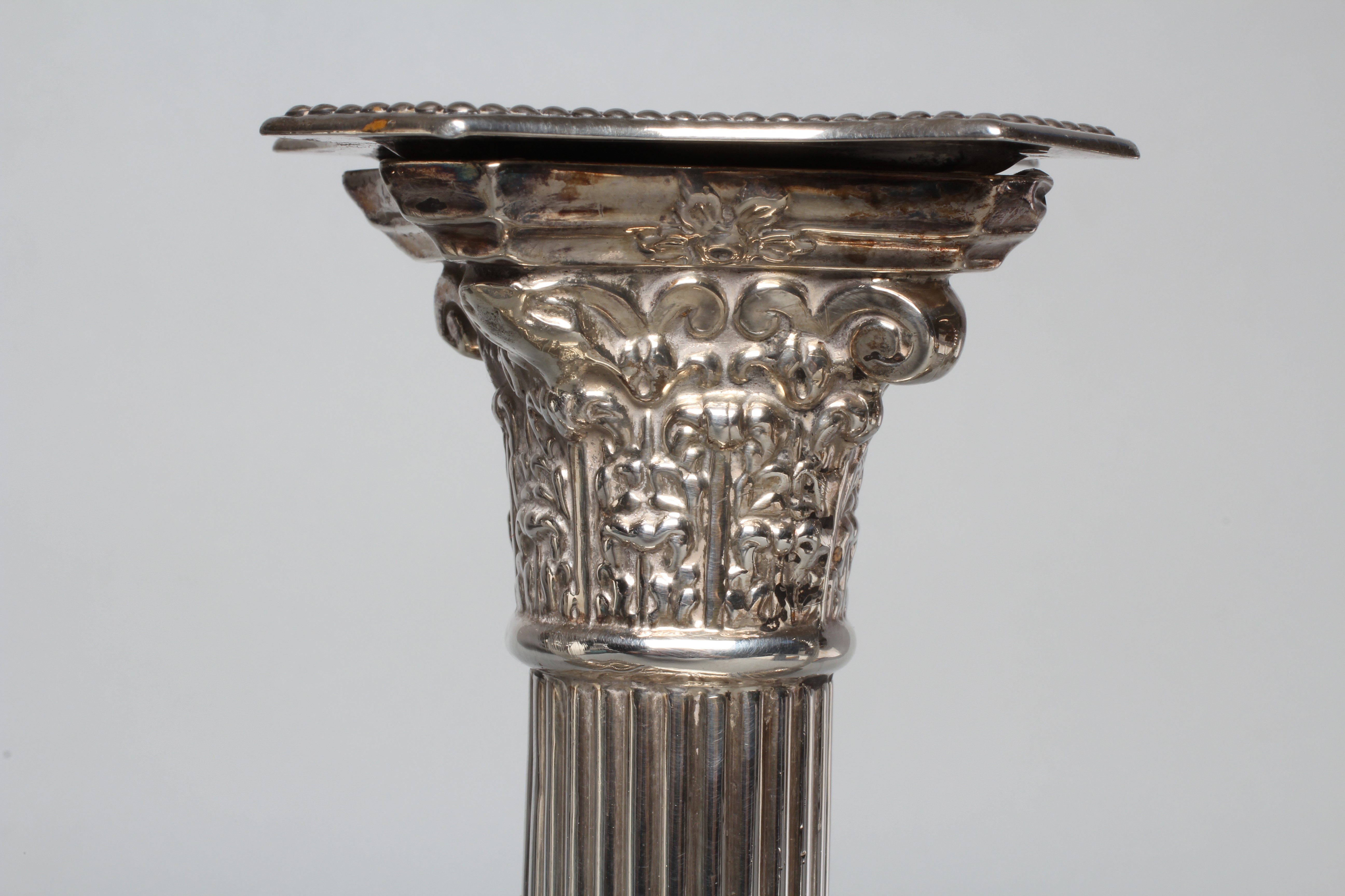 A PAIR OF GEORGE V CORINTHIAN COLUMN CANDLESTICKS by Atkin Brothers, Sheffield 1925, with detachable Image