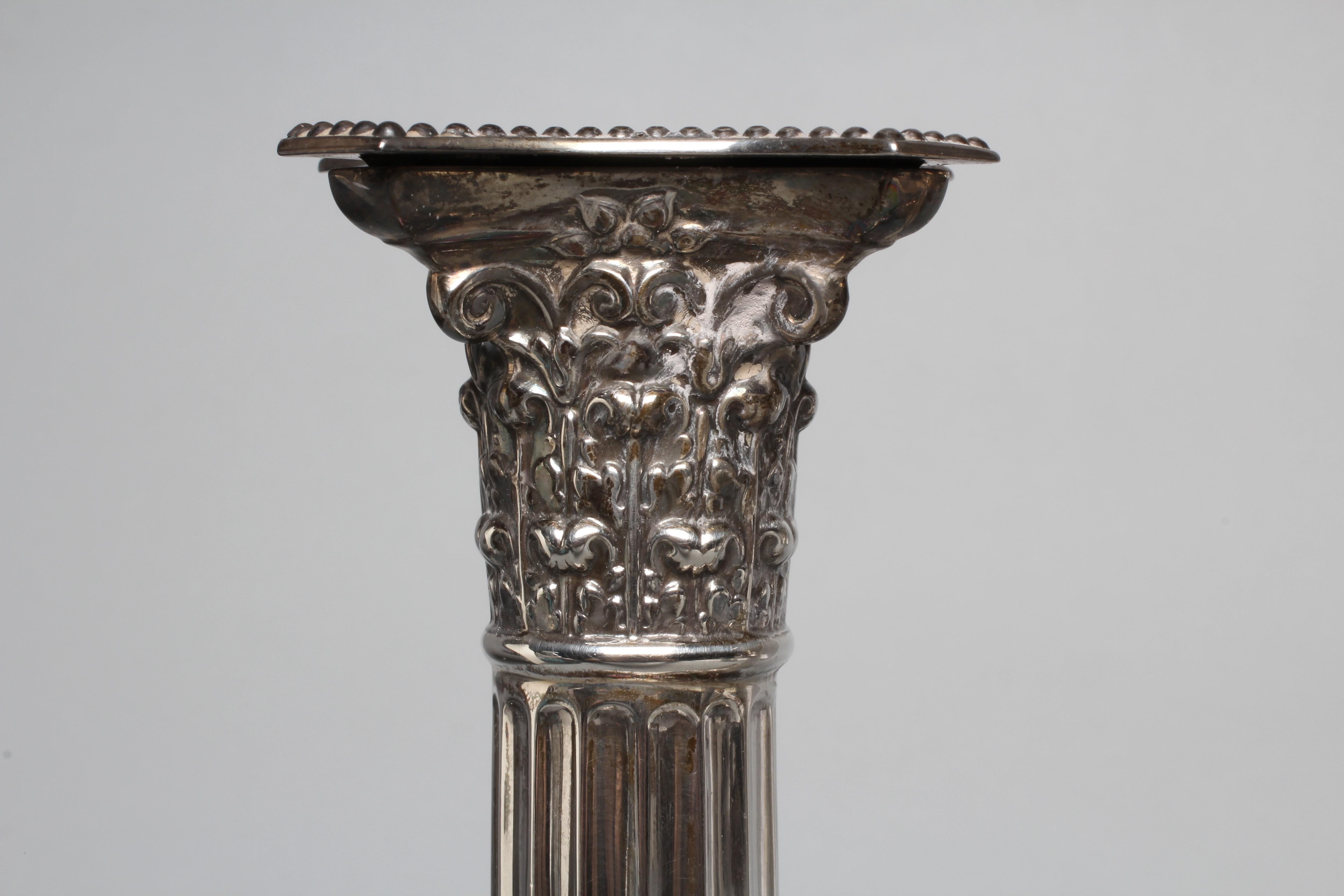 A PAIR OF GEORGE V CORINTHIAN COLUMN CANDLESTICKS by Atkin Brothers, Sheffield 1925, with detachable Image