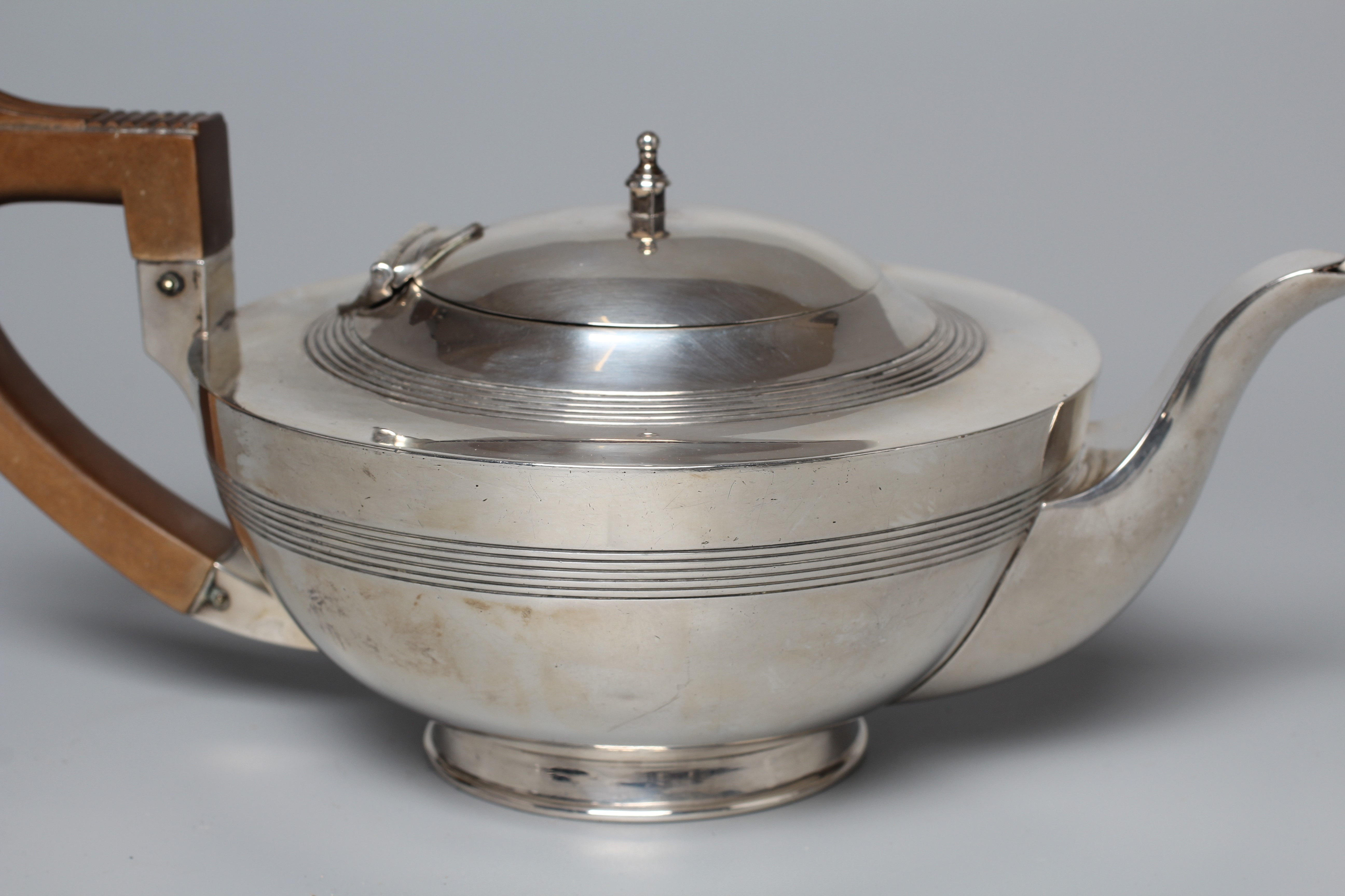 AN EARLY GEORGE V THREE PIECE TEA SERVICE by Walker & Hall Image