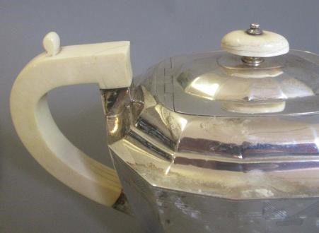 A GEORGE VI FOUR PIECE TEA SERVICE by Viners Image
