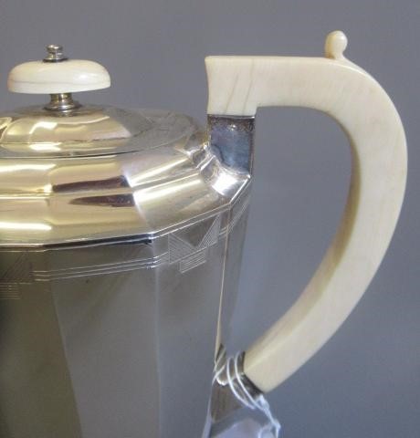 A GEORGE VI FOUR PIECE TEA SERVICE by Viners Image